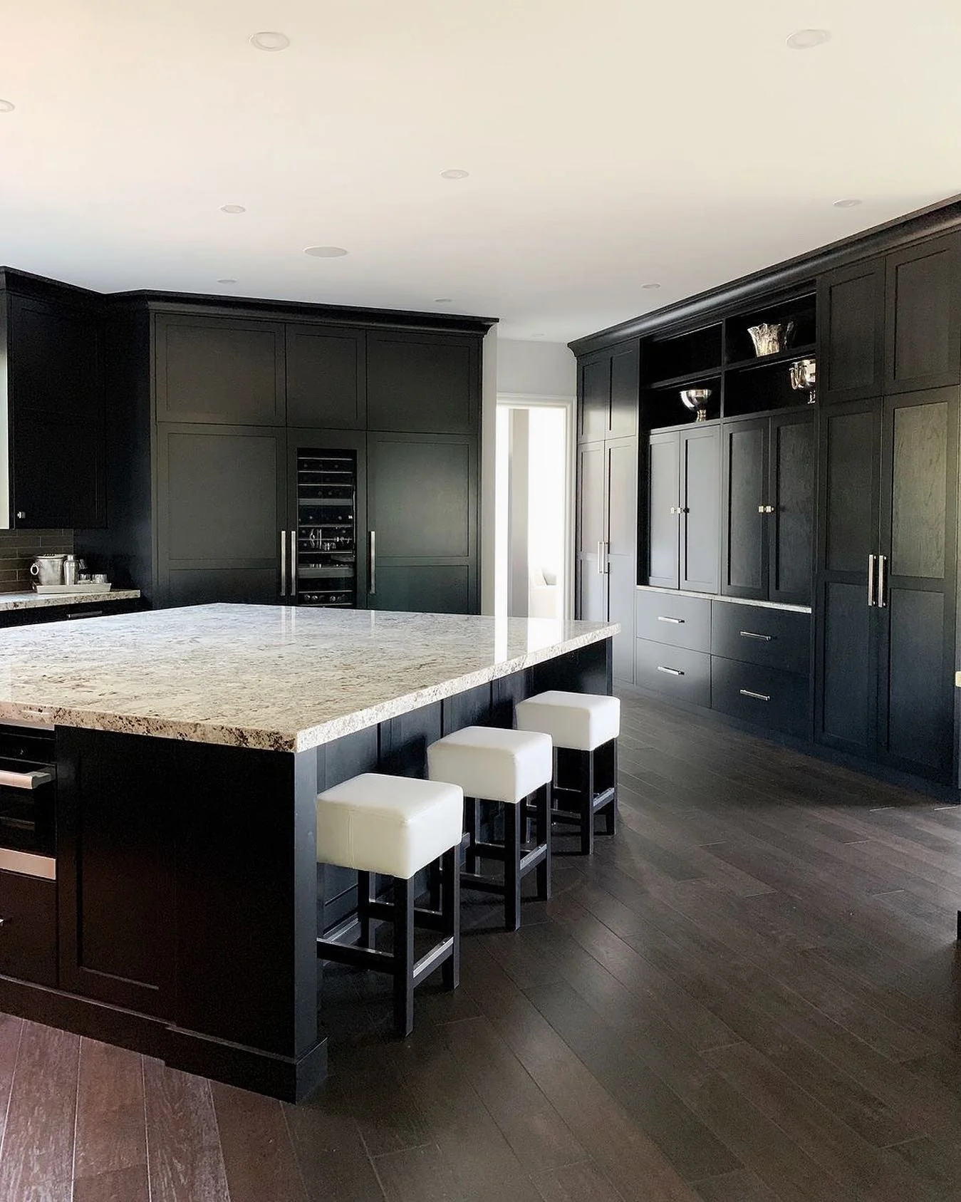 2. Classic Contrast with White Accents (Black Kitchen Ideas)