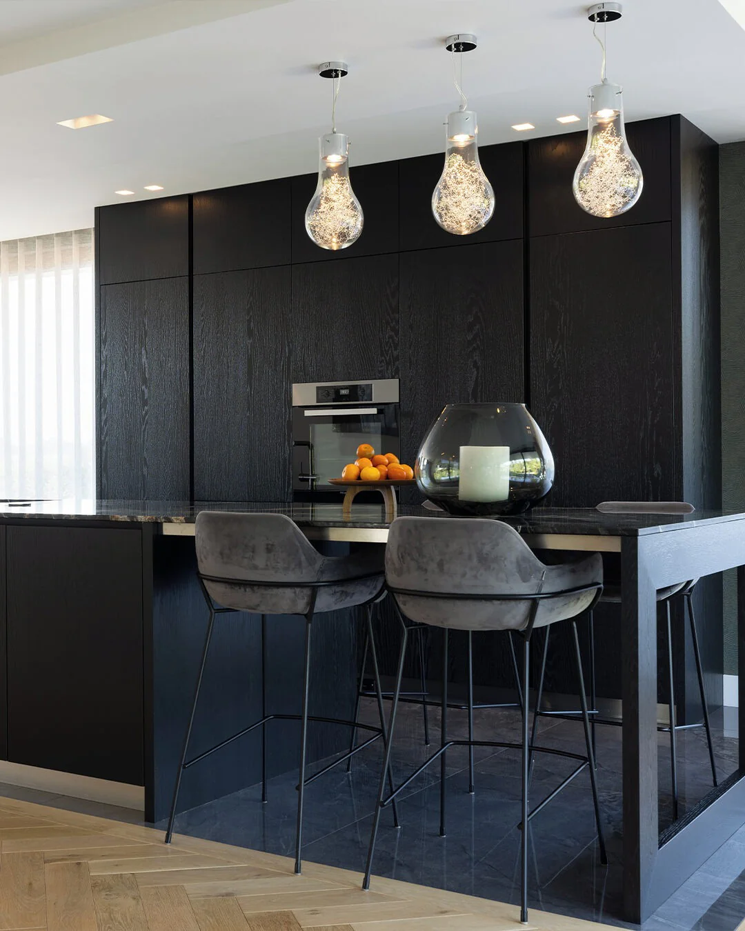 3. Polished Texture and Ambient Glow (Black Kitchen Ideas)