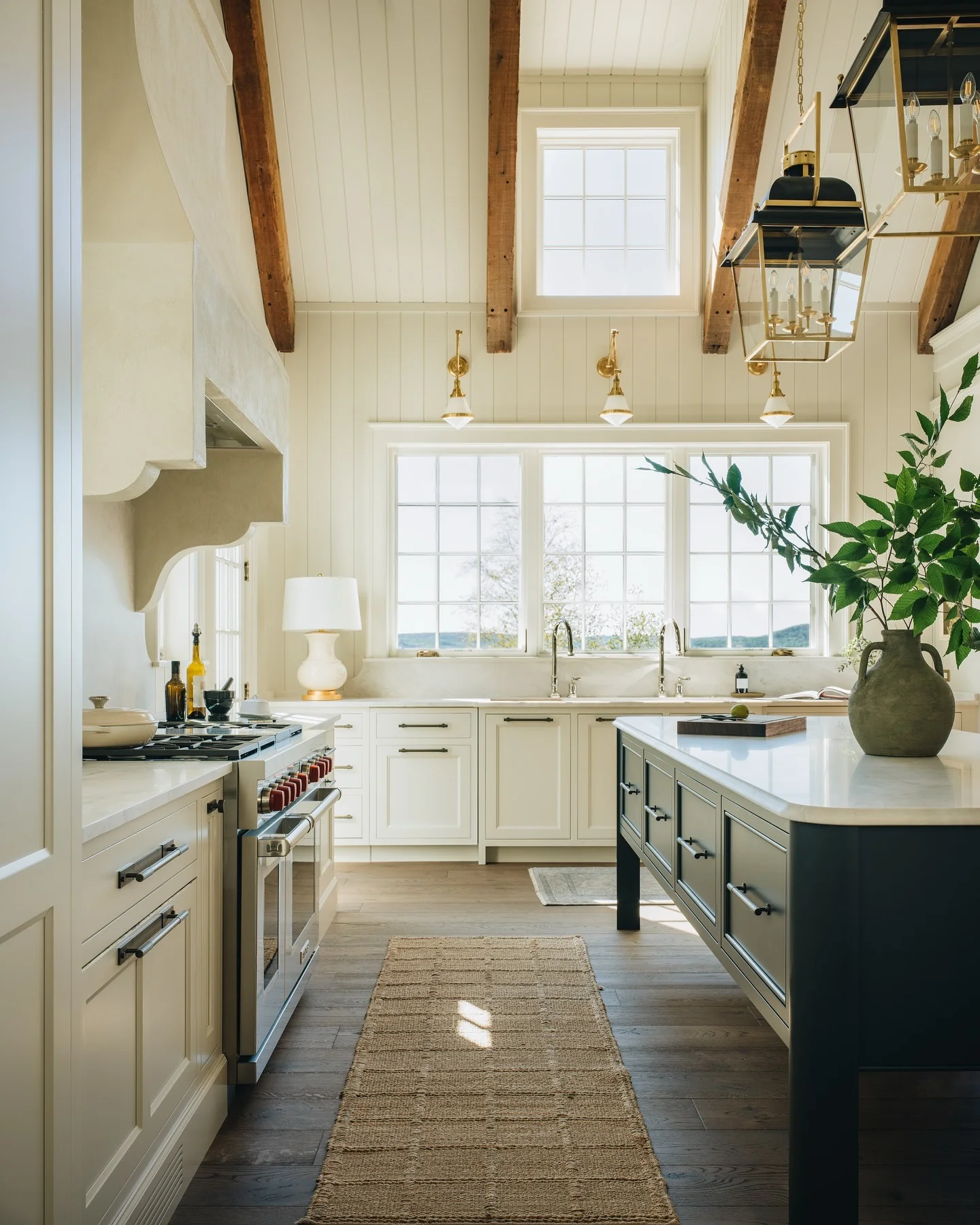 8. Farmhouse Fresh with Vaulted Beams and Transom Windows (Kitchen Window Ideas)