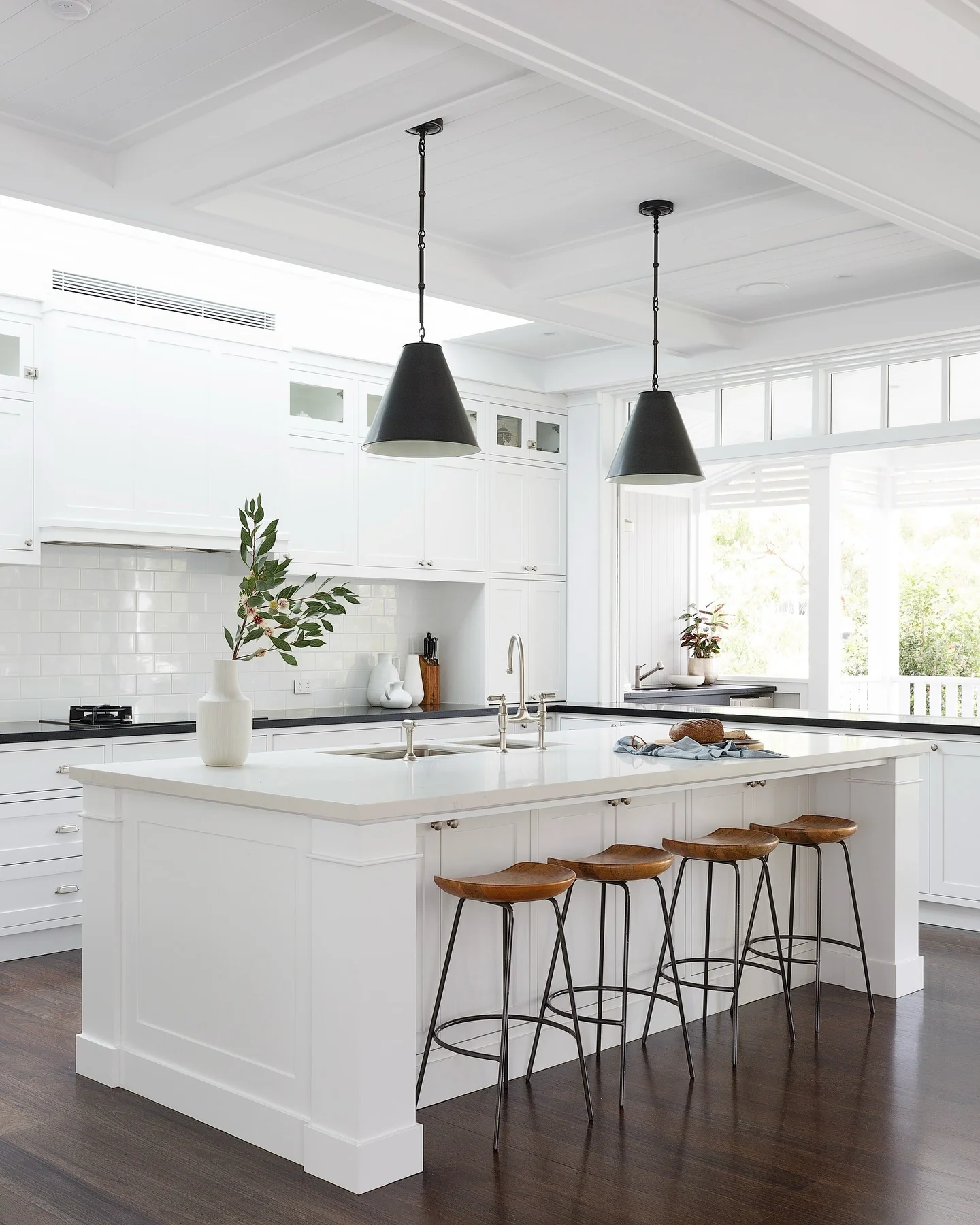 5. Streamlined Sophistication in Crisp White with Modern Pendant Accents (Kitchen Window Ideas)