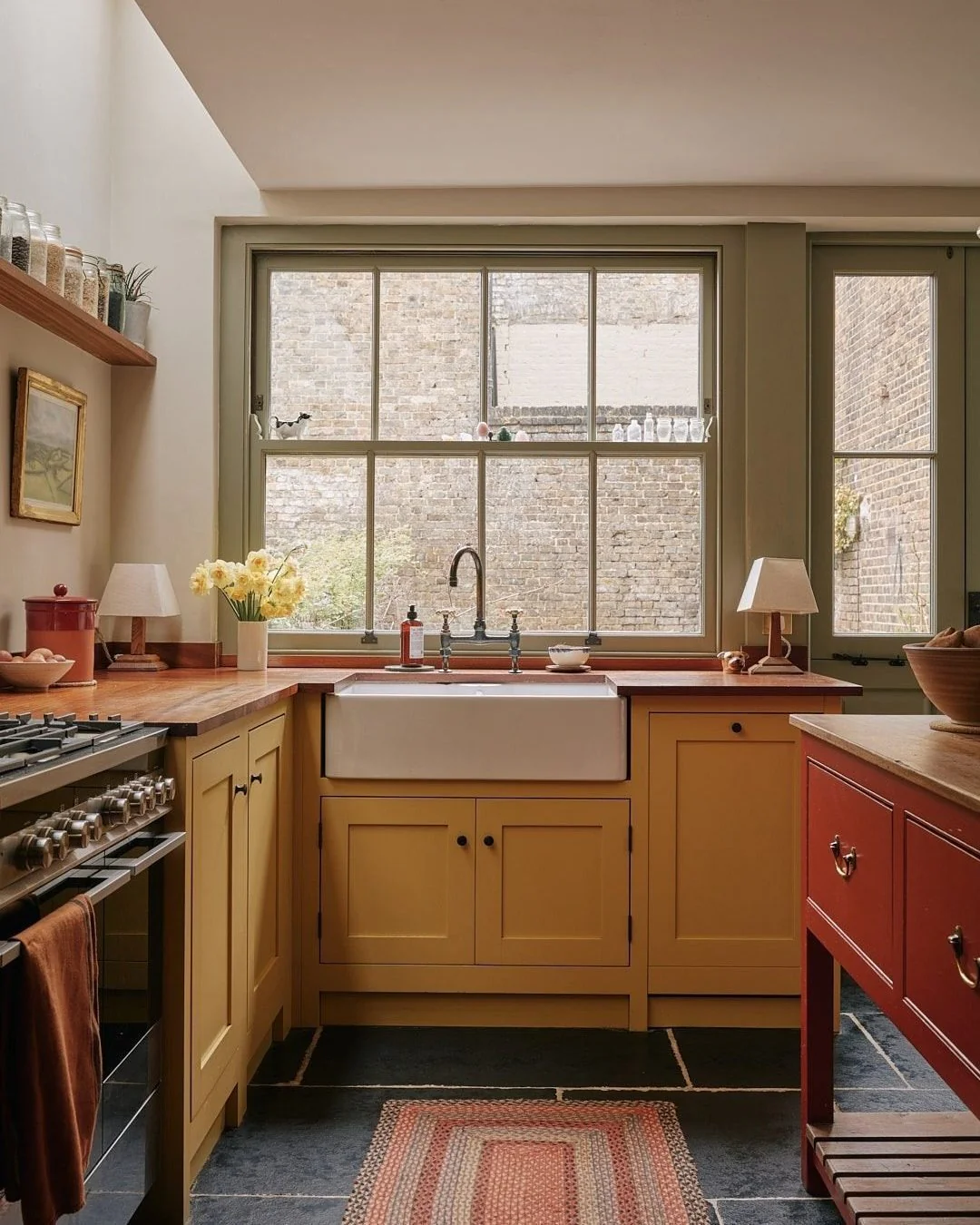 9. Rustic Warmth with Mustard Tones and Divided Light Window (Kitchen Window Ideas)