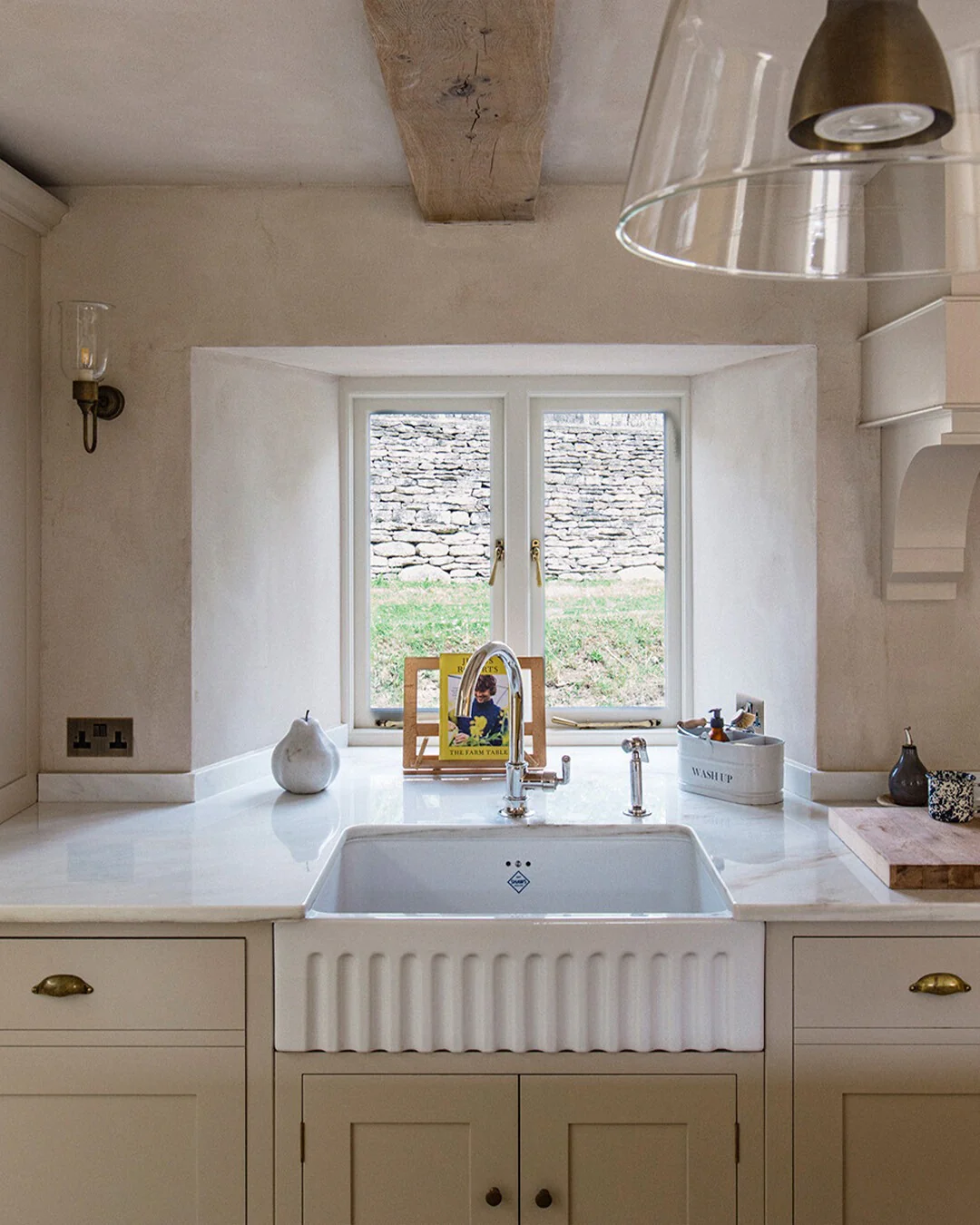 13. Cotswold-Inspired Niche with Deep Sill and Traditional Details (Kitchen Window Ideas)