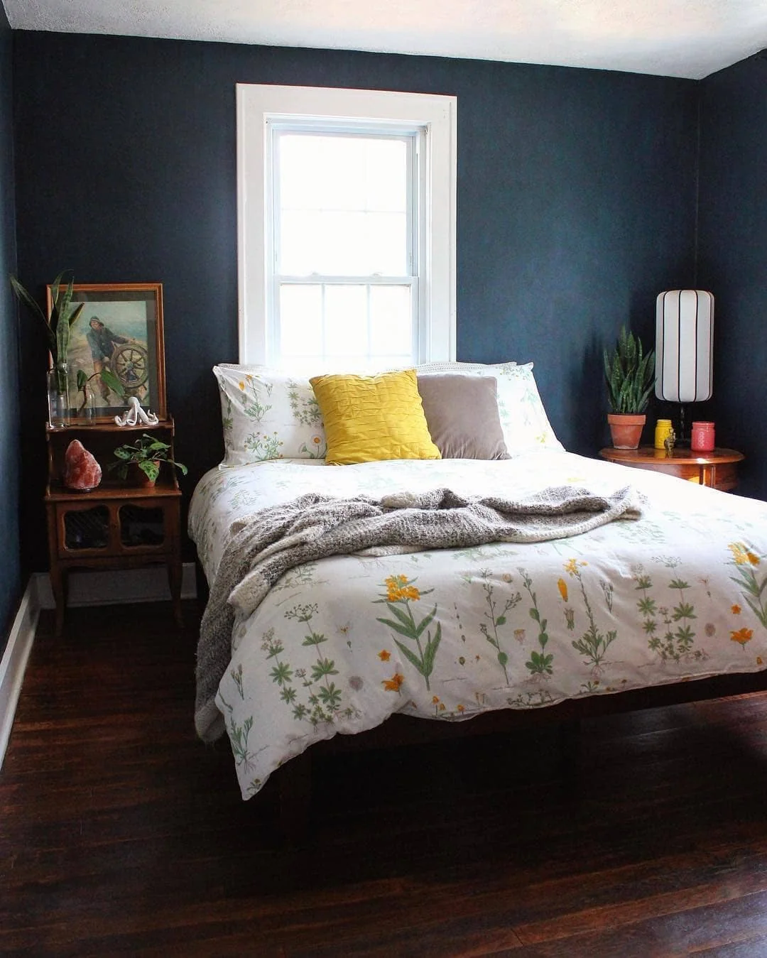 4. Botanical Calm with a Twist (Dark Blue Bedroom Ideas)
