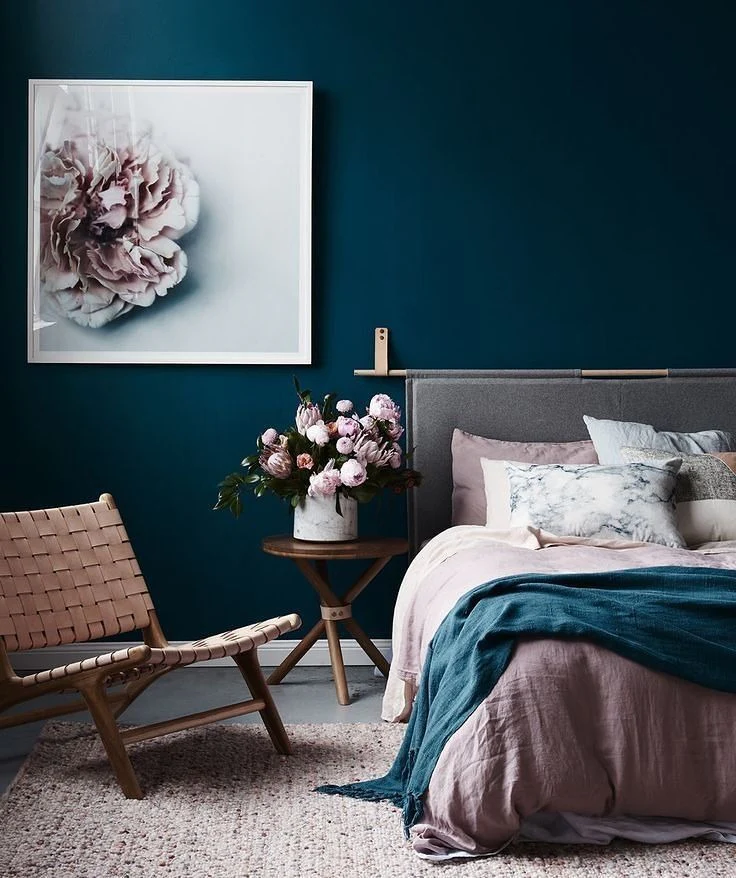 5. Floral Softness Meets Moody Blue (Dark Blue Bedroom Ideas)