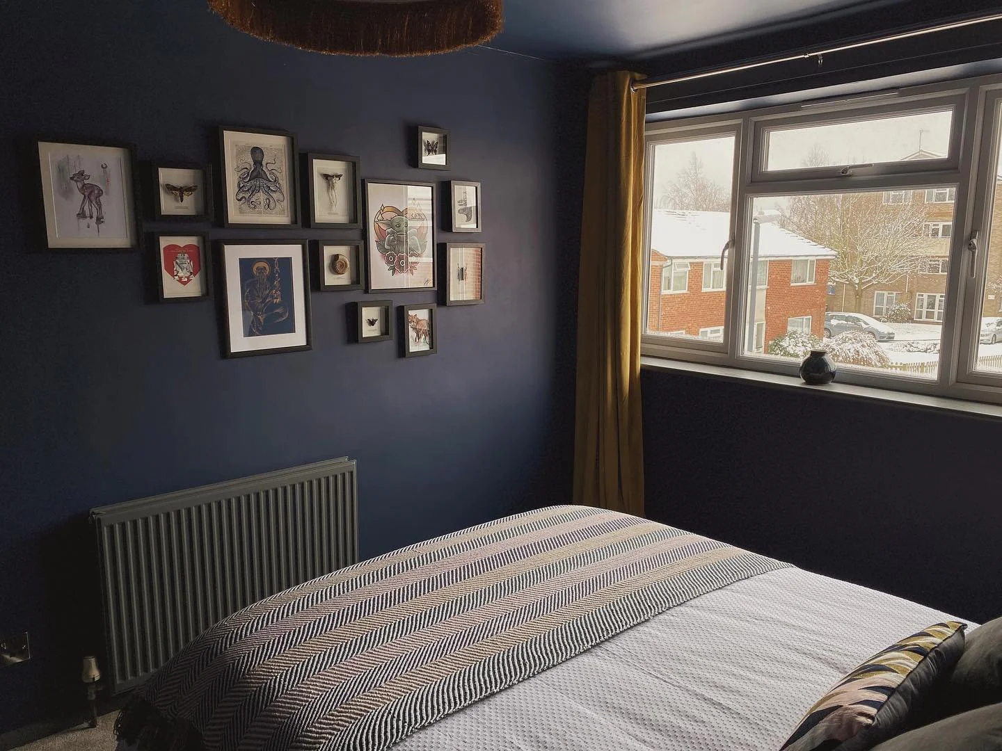 7. Gallery Style with Edge (Dark Blue Bedroom Ideas)