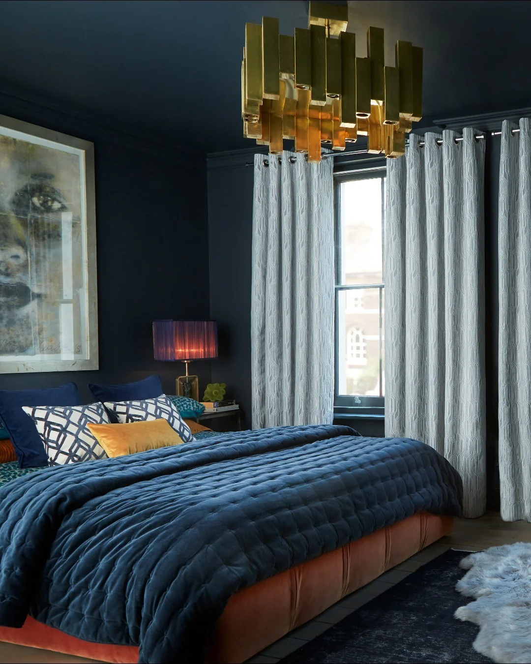 14. Moody Drama with Brass and Velvet (Dark Blue Bedroom Ideas)