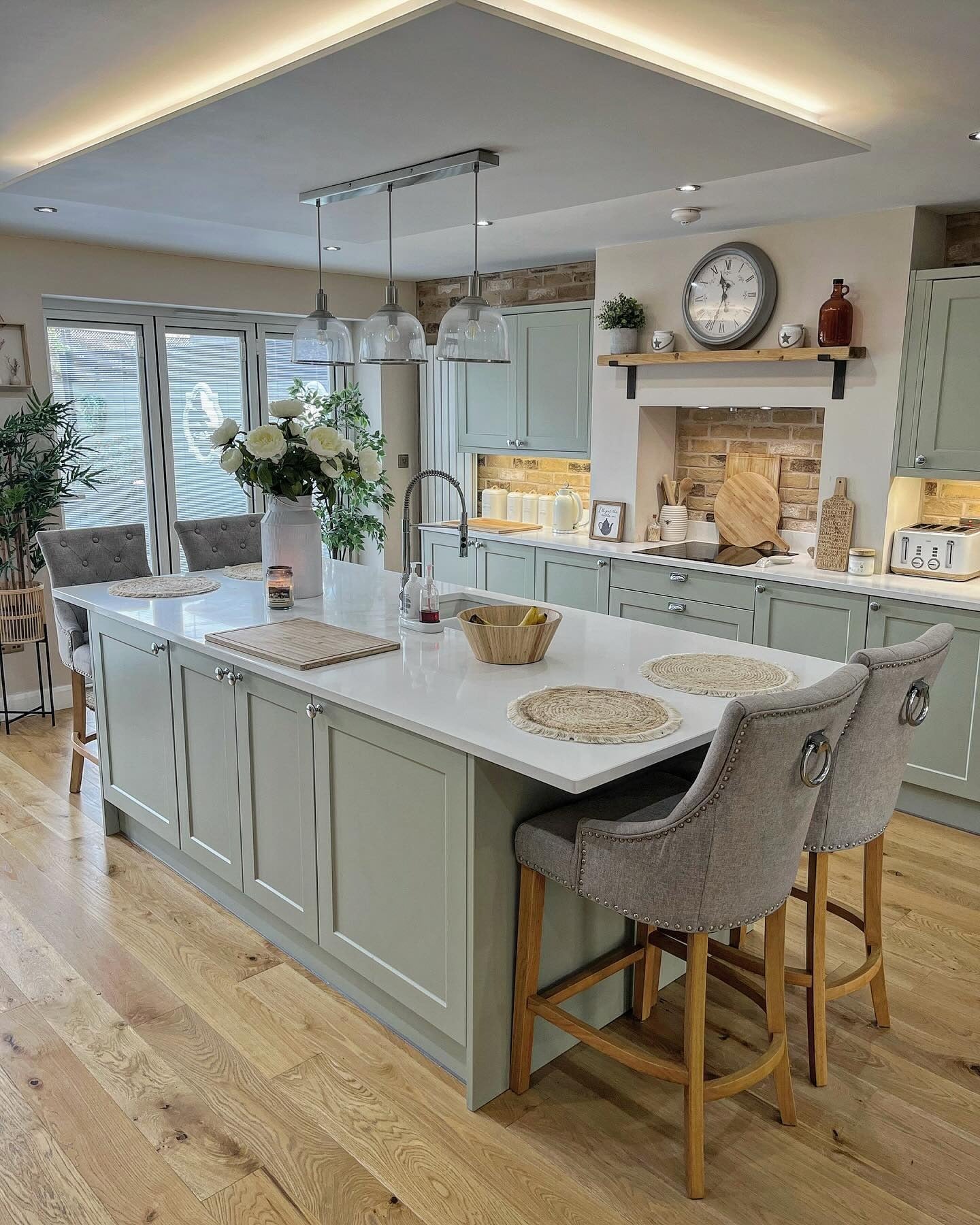 13. Sage Green with Subtle Brick Texture (Victorian Style Kitchen Ideas)