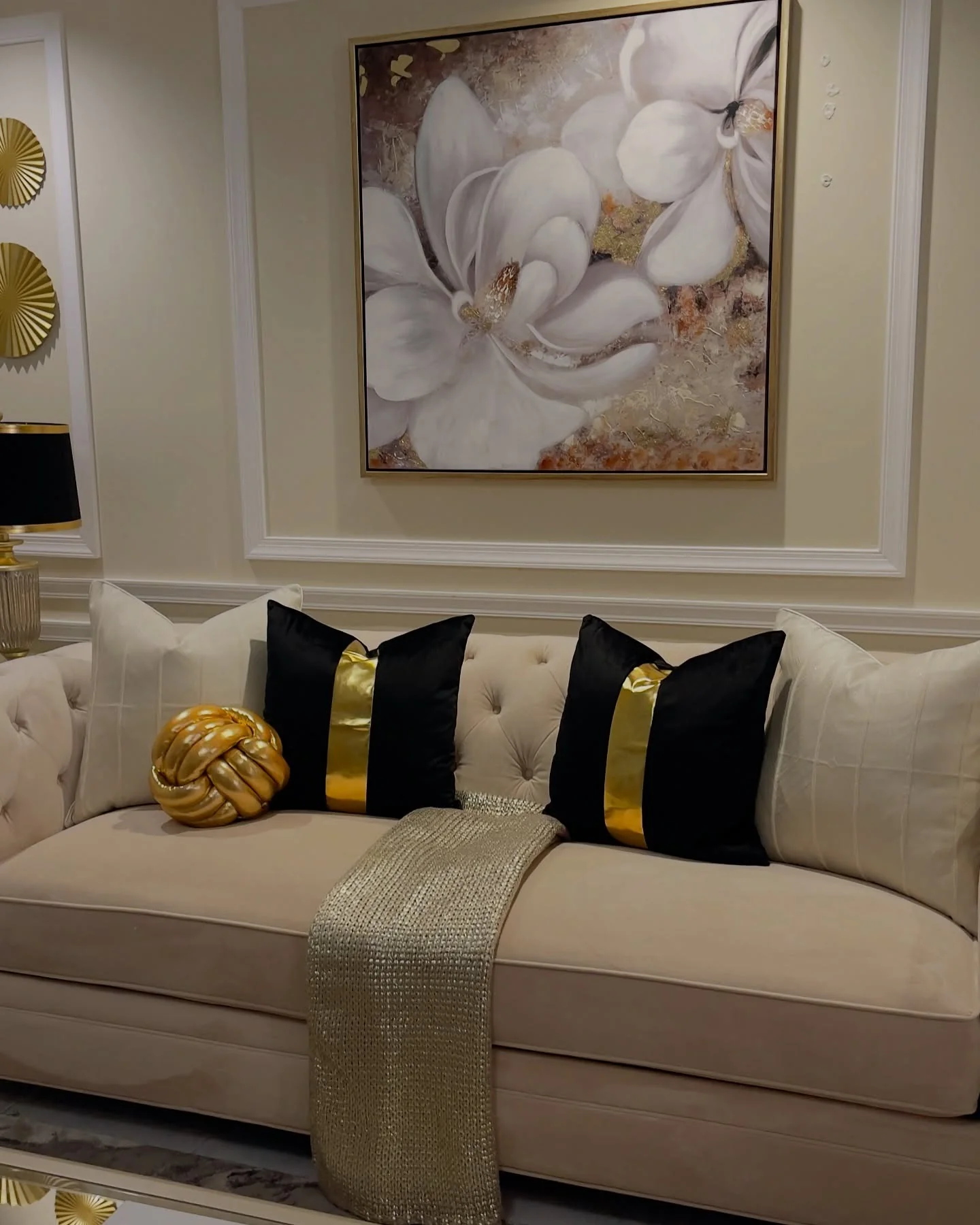 6. Artful Florals with Gold Drama (Black and Gold Living Room Ideas)