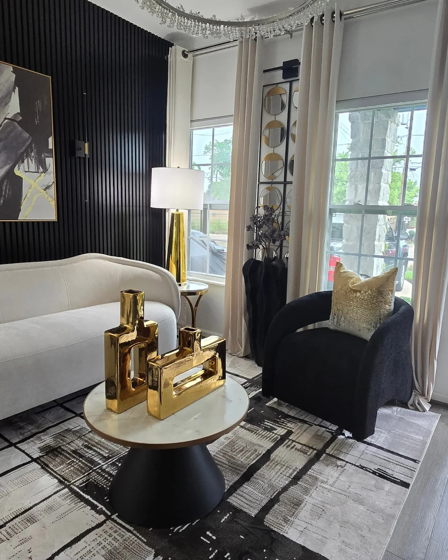 8. Sculptural Minimalism in Monochrome Contrast (Black and Gold Living Room Ideas)