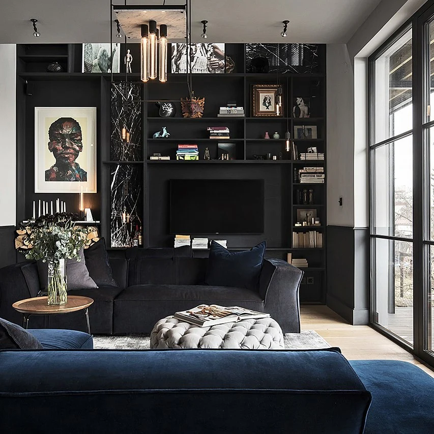 5. Moody Elegance with Velvet and Bookshelves (Black Living Room Ideas)