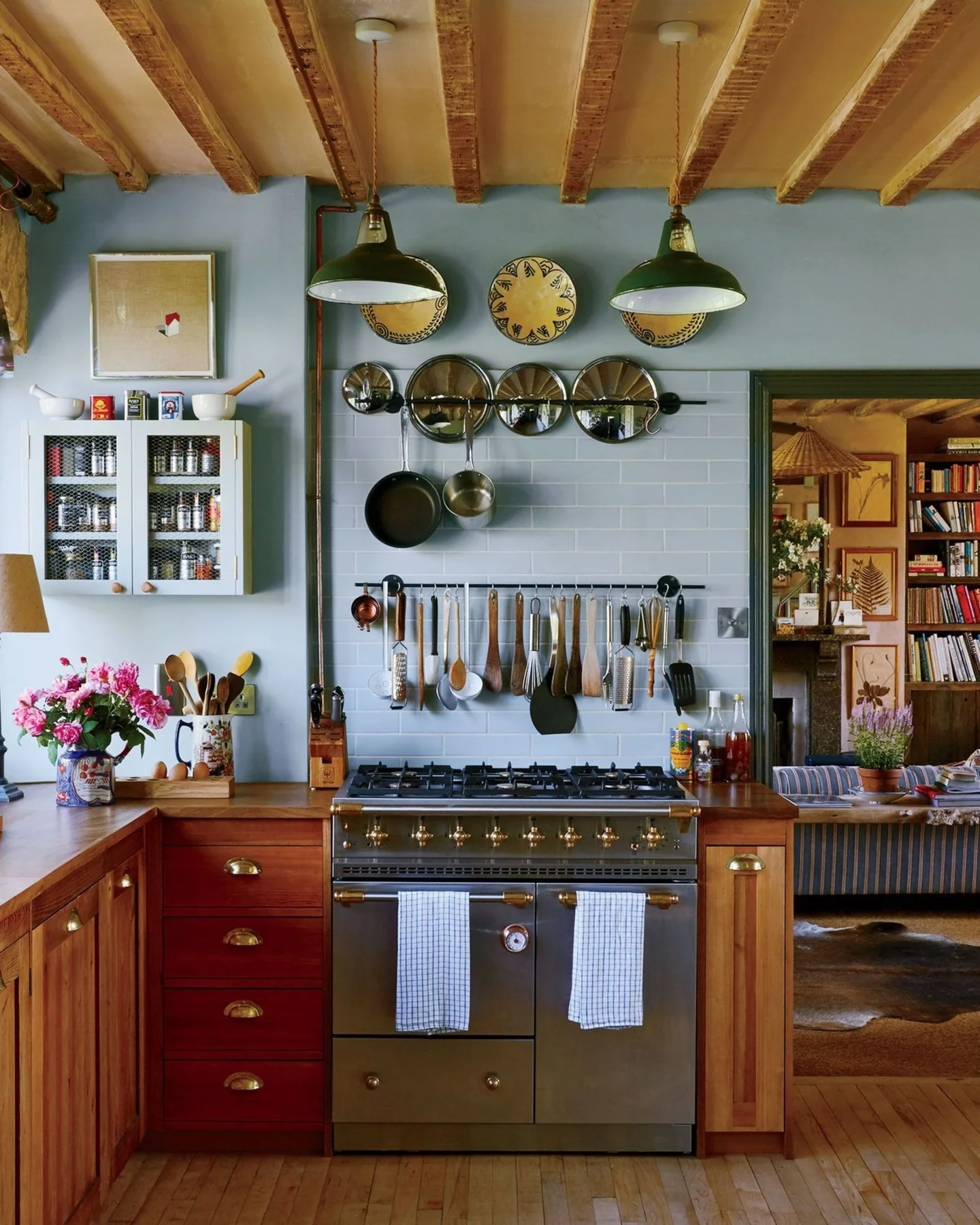 5. Cottage Craft with a Collector’s Touch (Rustic Kitchen Island Ideas)