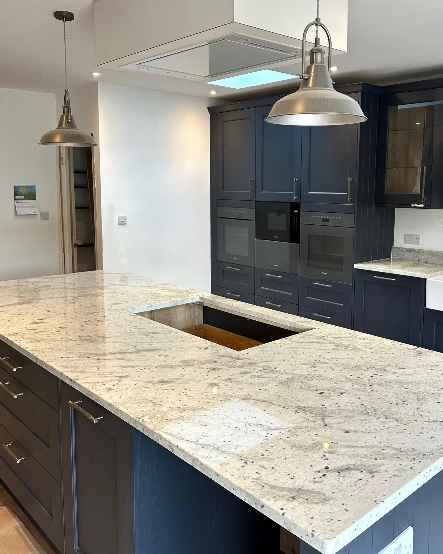 3. Subtle Contrast with Cream-Speckled Granite (Granite Countertops Kitchen Ideas)