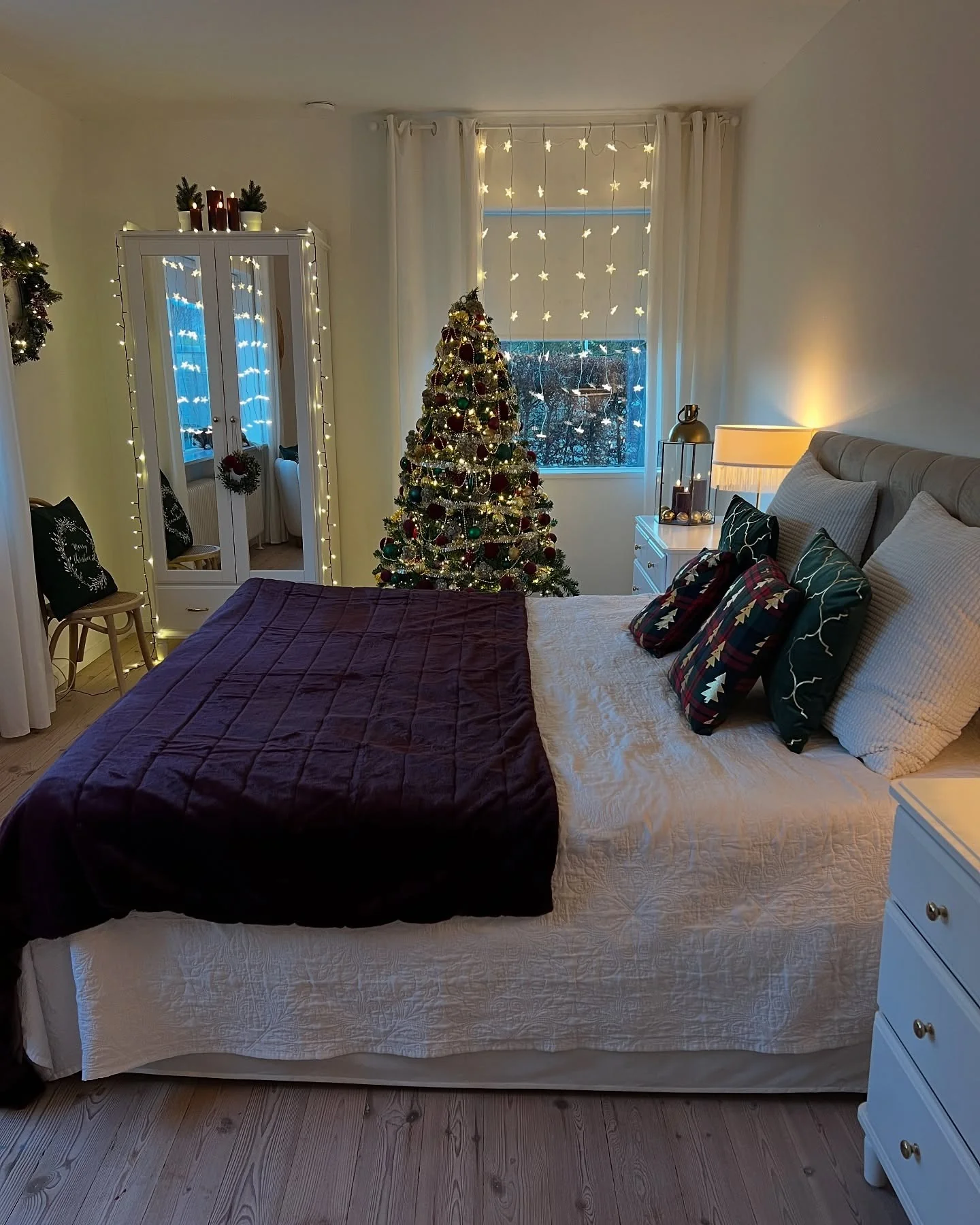 19. Twinkle-Lit Forest Green and Plum Layers (Christmas Bedroom Ideas)