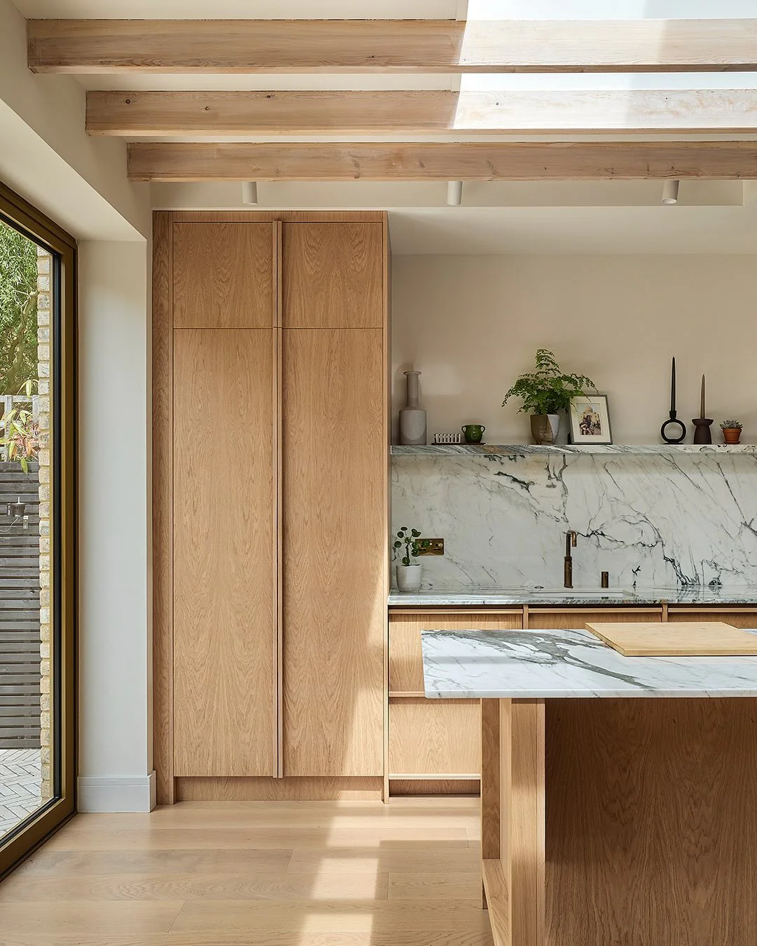 22. Light Oak and Sky-Lit Marble Backdrop (Oak Cabinets Kitchen Ideas)