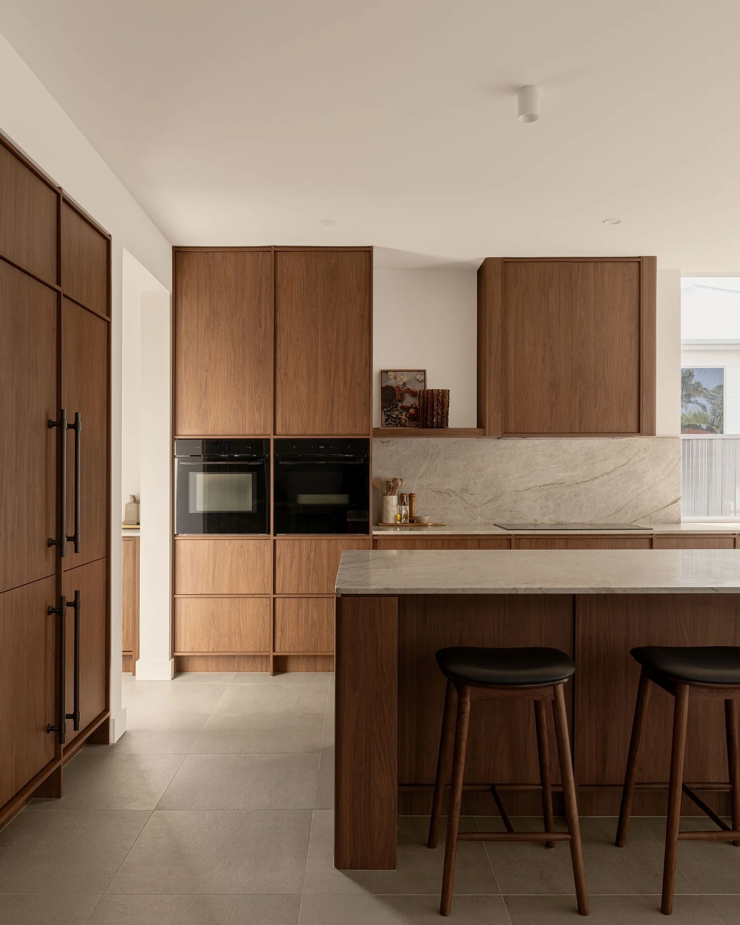 24. Contemporary Walnut Oak with Stone Veining (Oak Cabinets Kitchen Ideas)