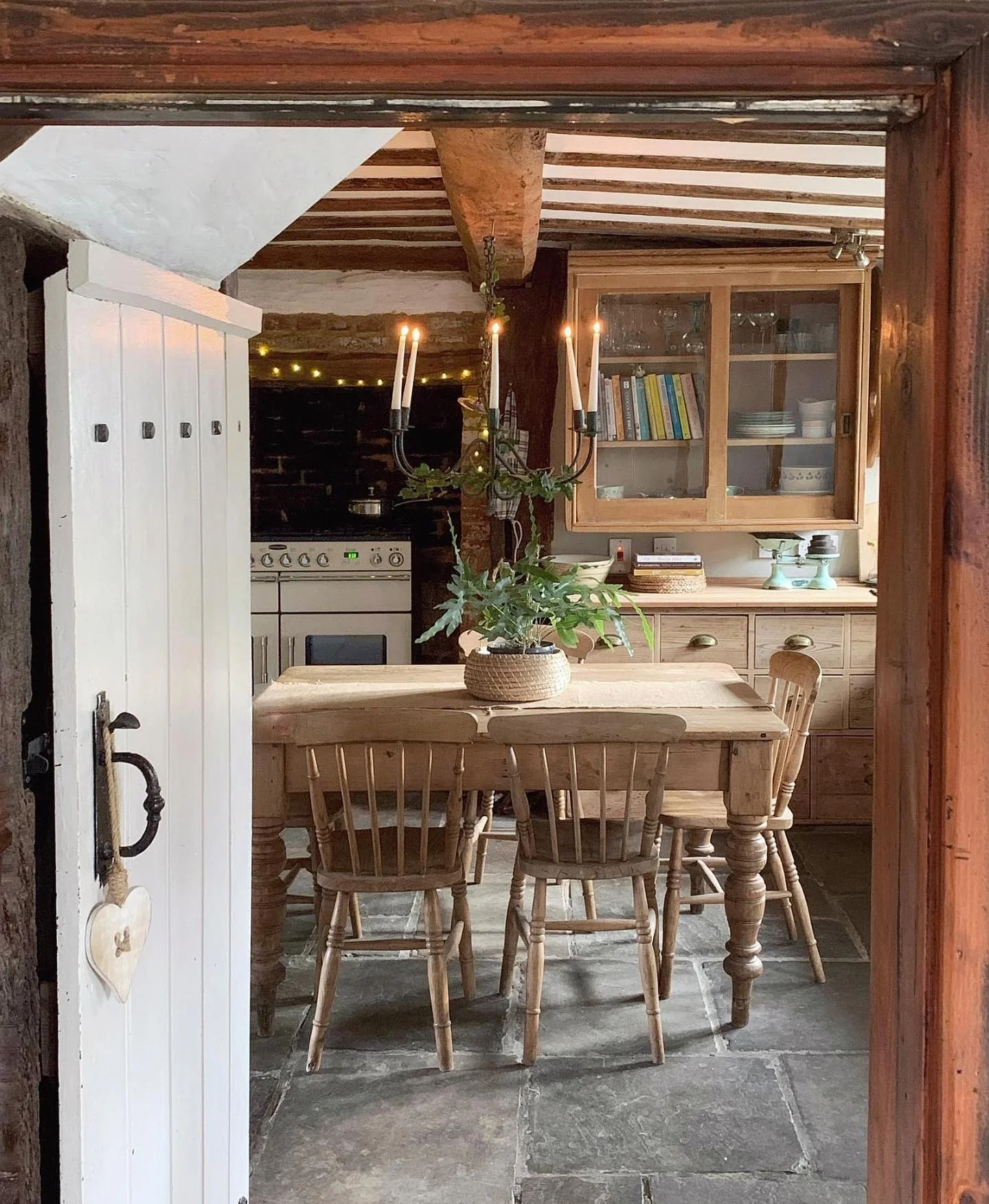 25. Candlelit Cottage Kitchen with Stone Flooring (Farmhouse Kitchen Ideas)