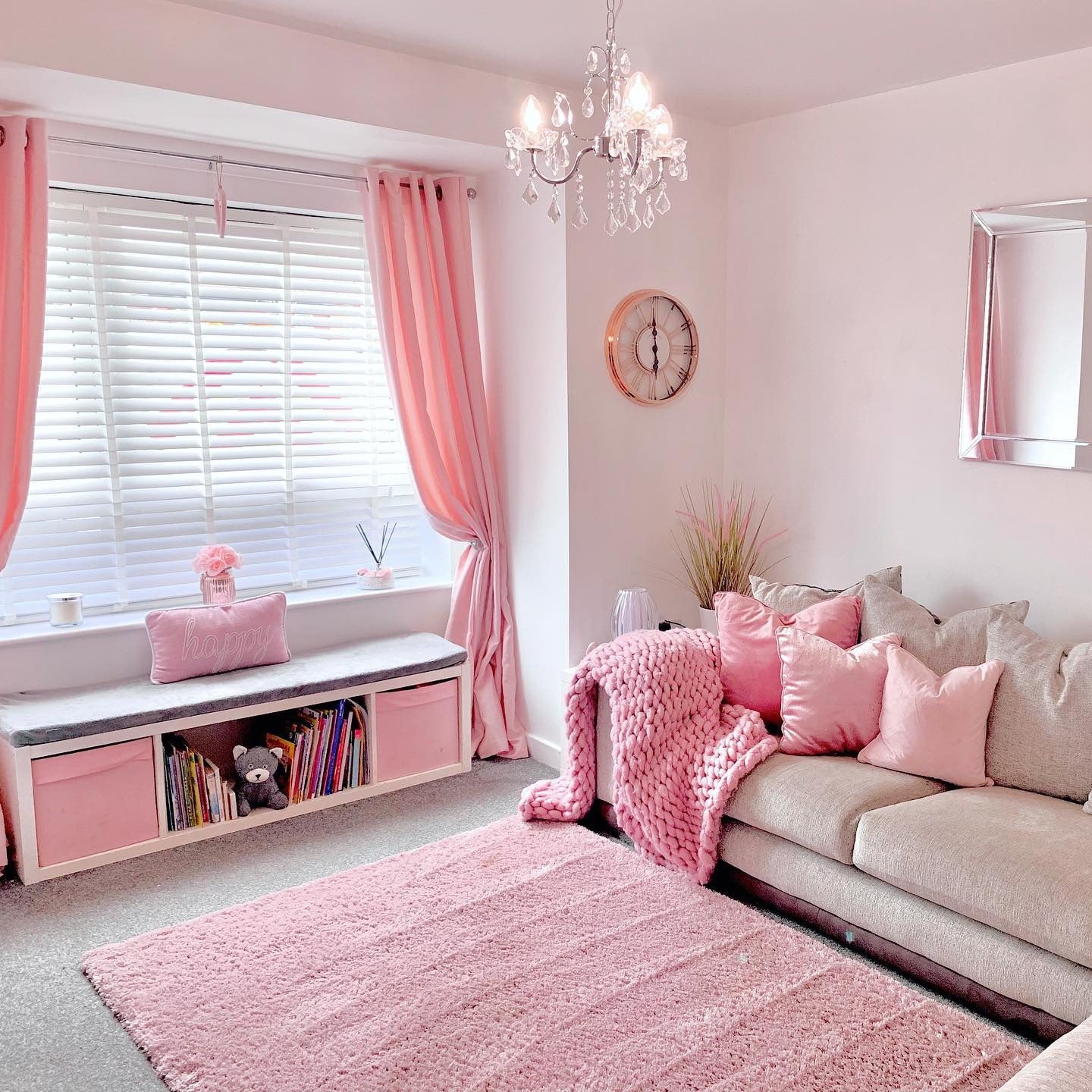 9. Family-Friendly and Pink All Over (Pink Living Room Ideas)