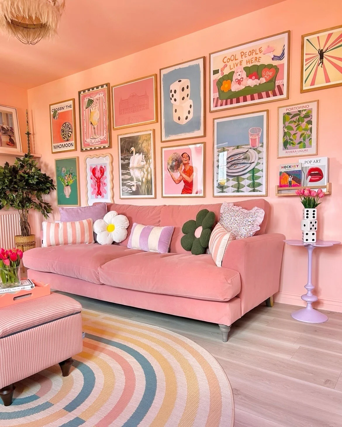 16. Gallery Wall with Retro Playfulness (Pink Living Room Ideas)