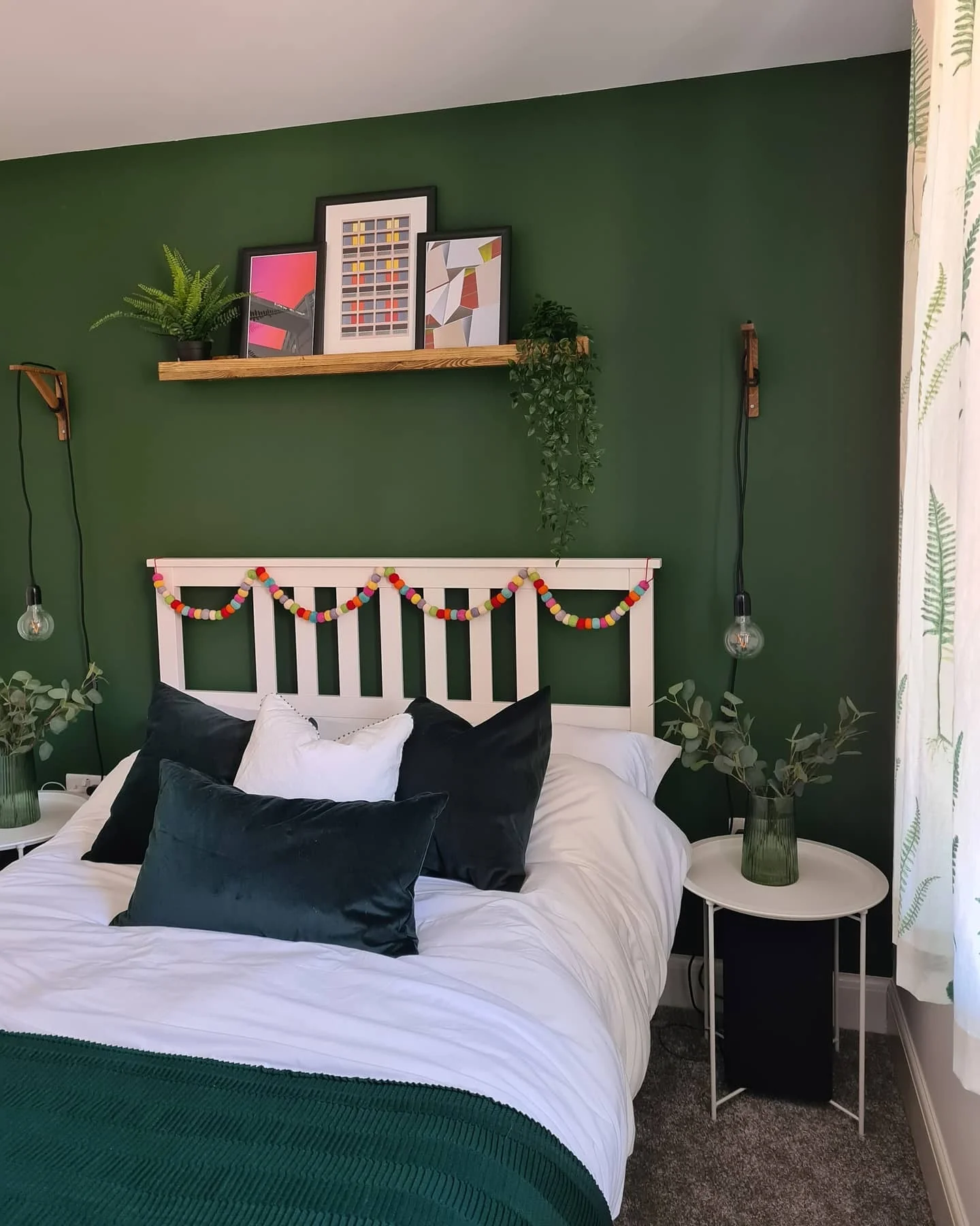 6. Lush Green with Playful Shelf Styling (Dark Green Bedroom Ideas)