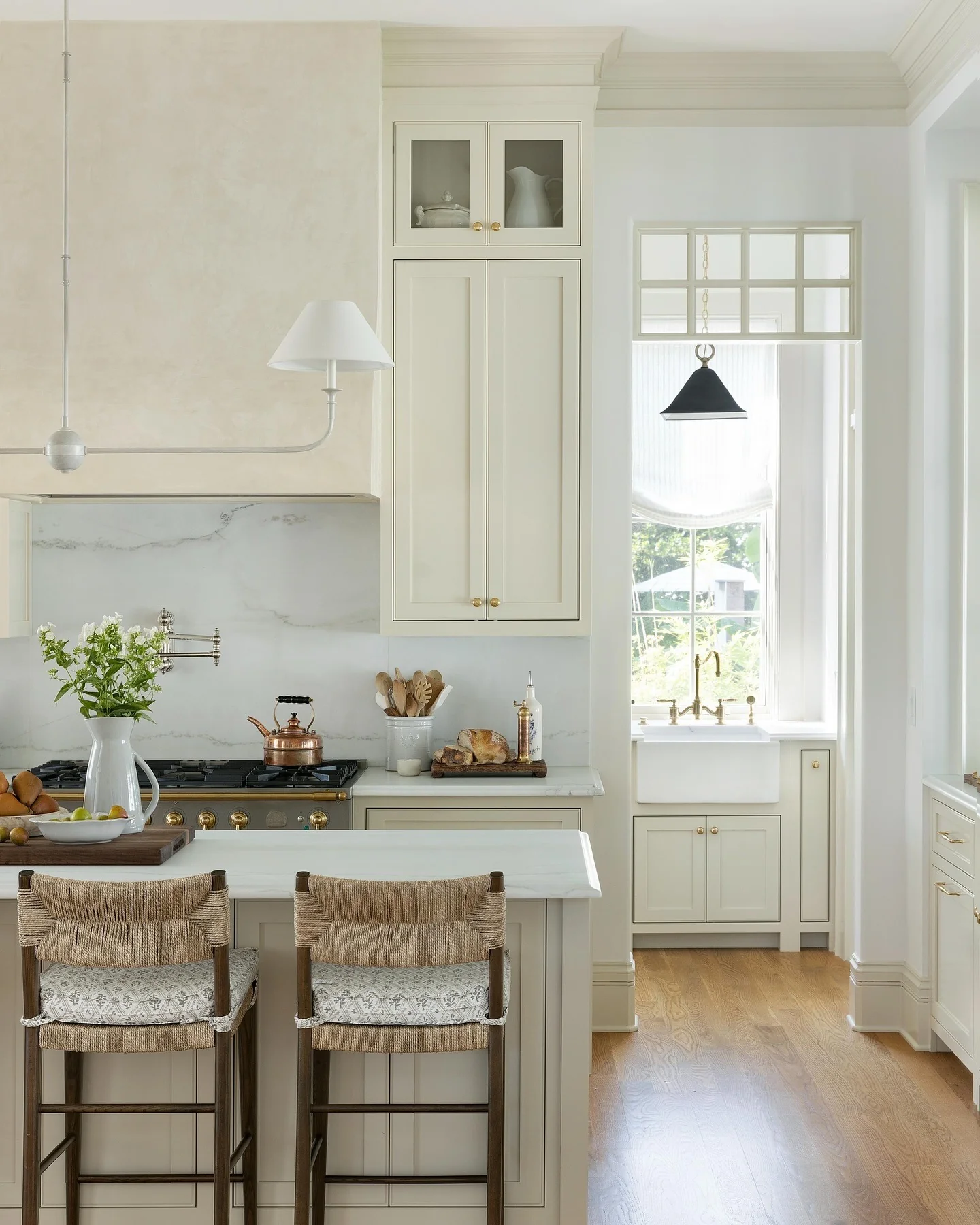 6. Refined Neutrals with Marble and Textured Woven Seating (classic kitchen ideas)