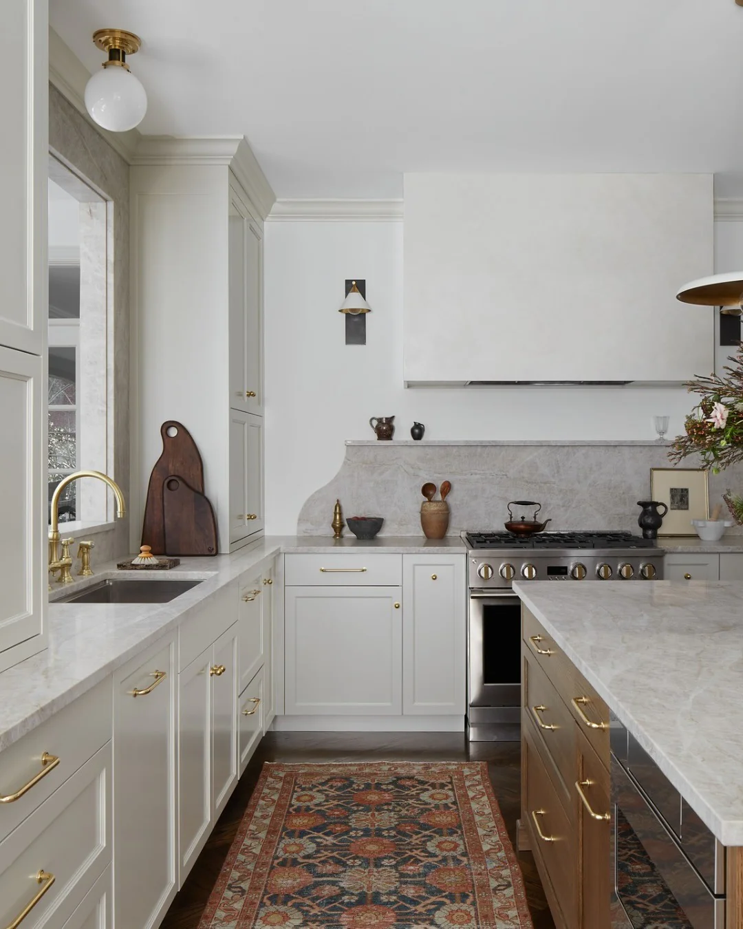13. Layered Neutrals with Classic Rug and Brass Details (classic kitchen ideas)