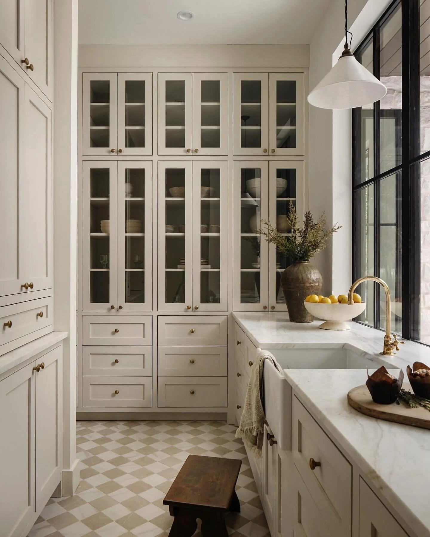 22. Quiet Luxury with Glass-Front Cabinets and Soft Neutrals (classic kitchen ideas)