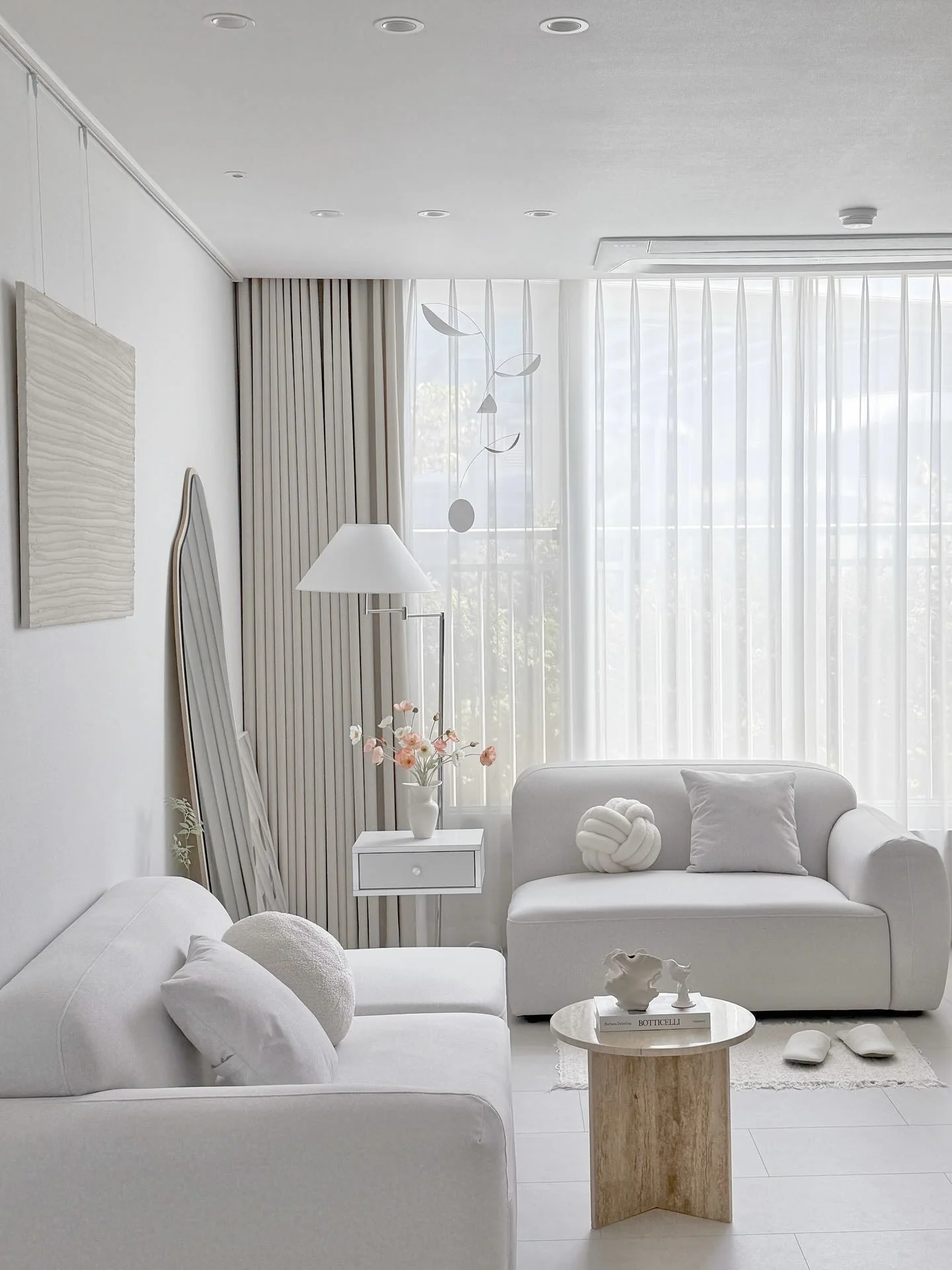 8. Monochrome Light with Textural Depth (White Living Room Ideas)