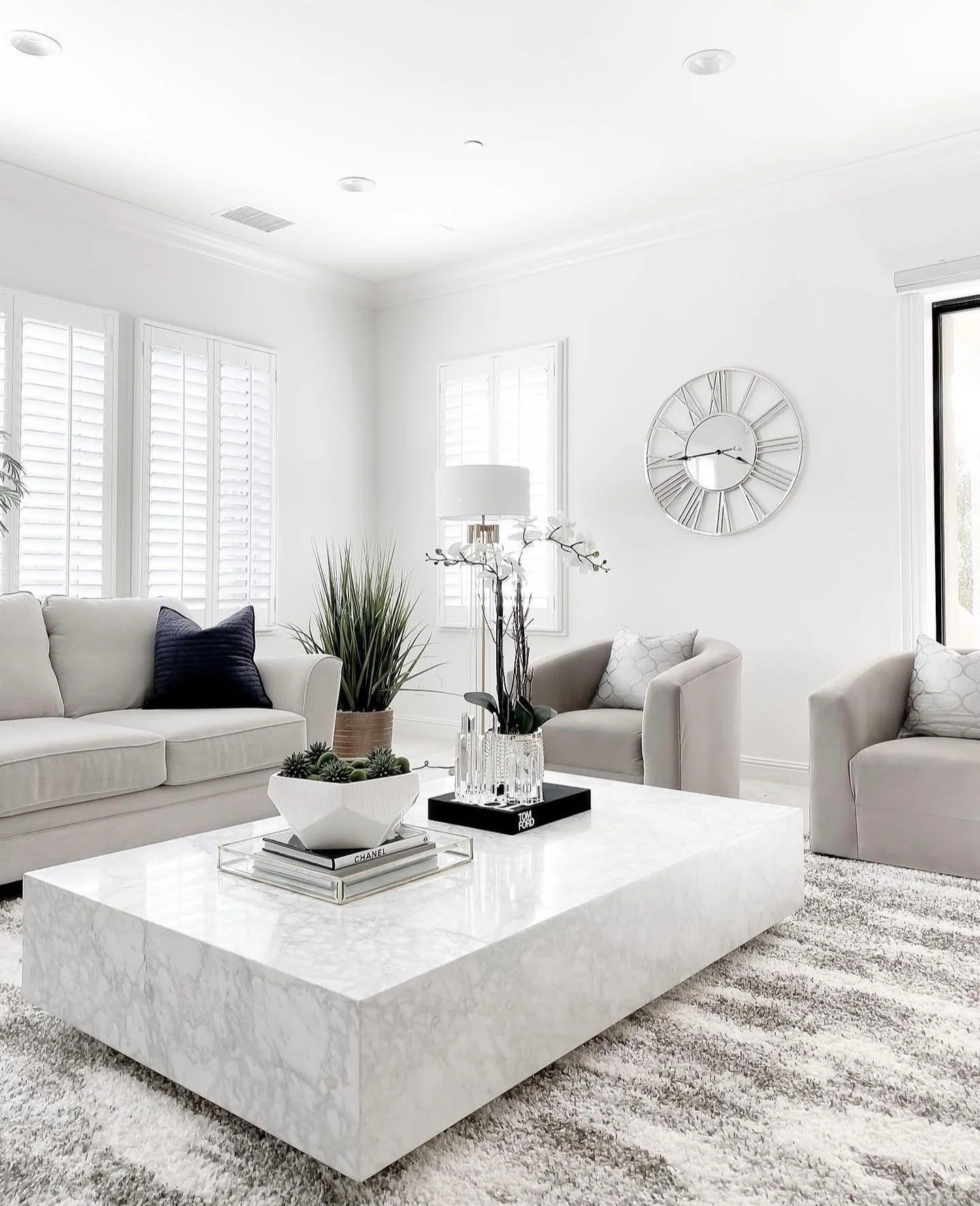 9. Polished Modern with Glam Details (White Living Room Ideas)