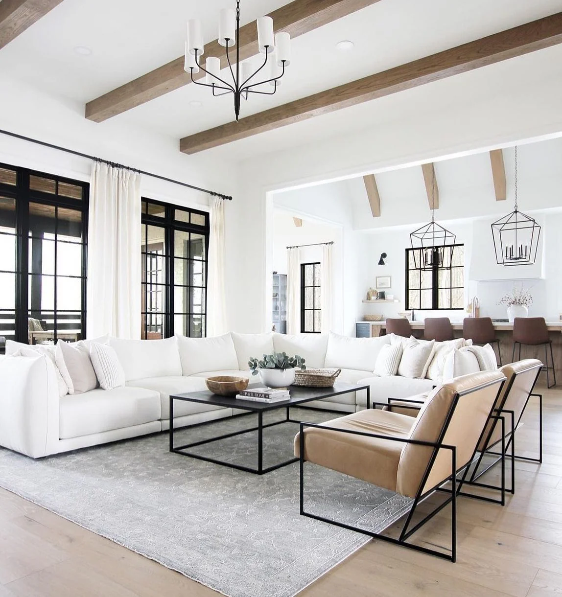 10. Open-Plan White Elegance with Architectural Detail (White Living Room Ideas)