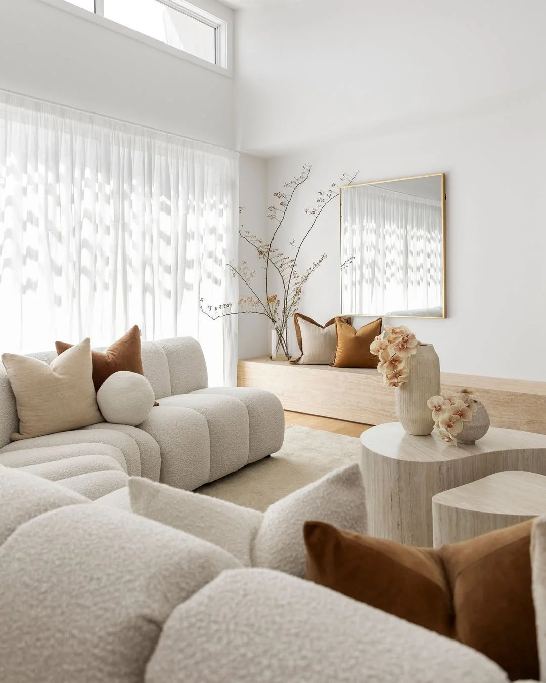 23. Layered Neutrals with Soft Geometry (White Living Room Ideas)