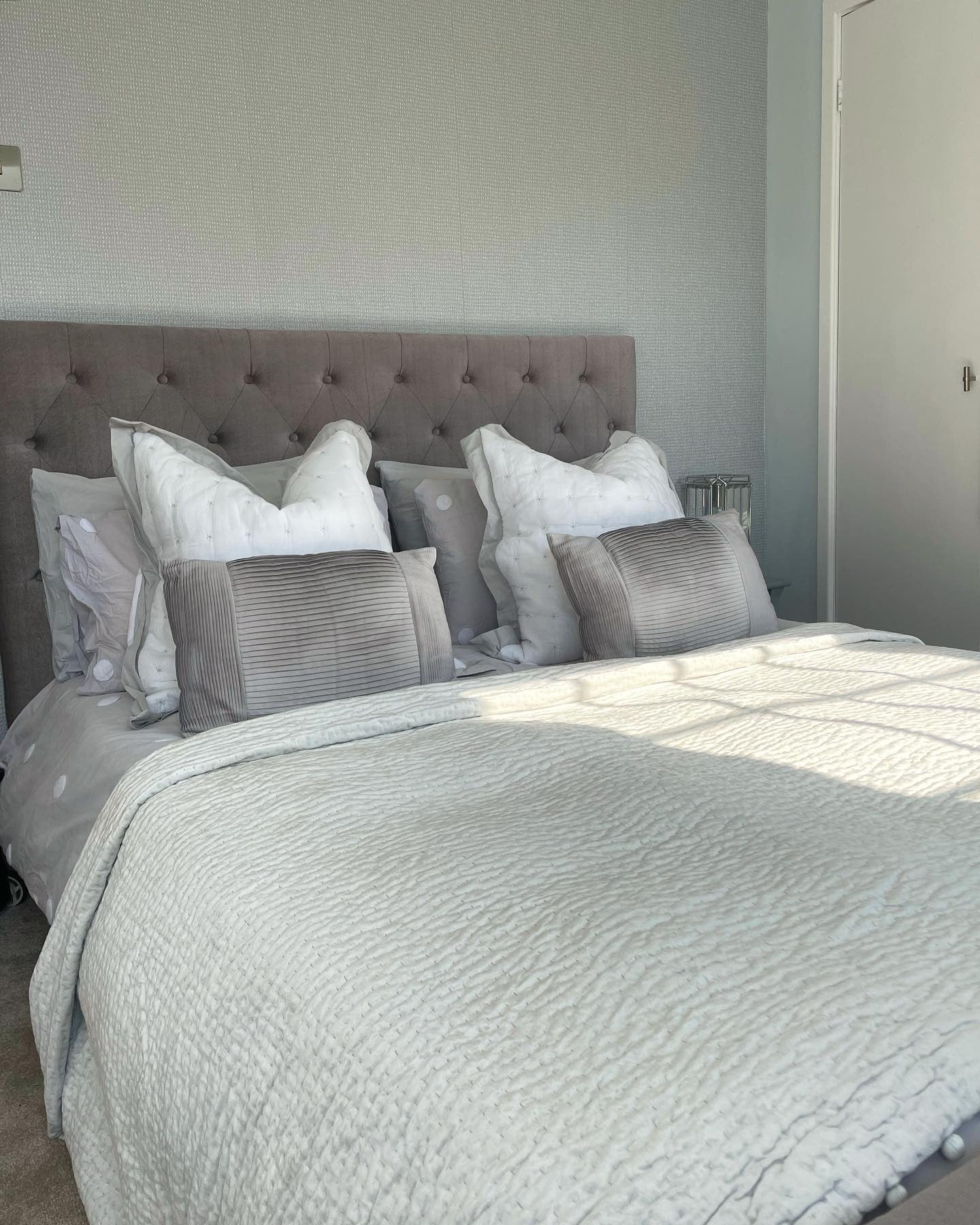 9. Soft Grey Serenity with Button-Tufted Detail (Spare Bedroom Ideas)