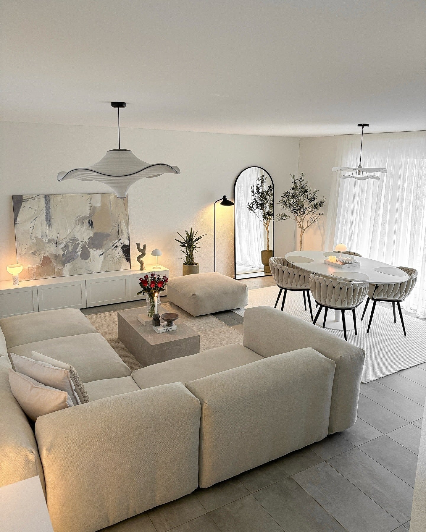 18. Layered Light With Sculpted Elegance (Cozy Living Room Ideas)