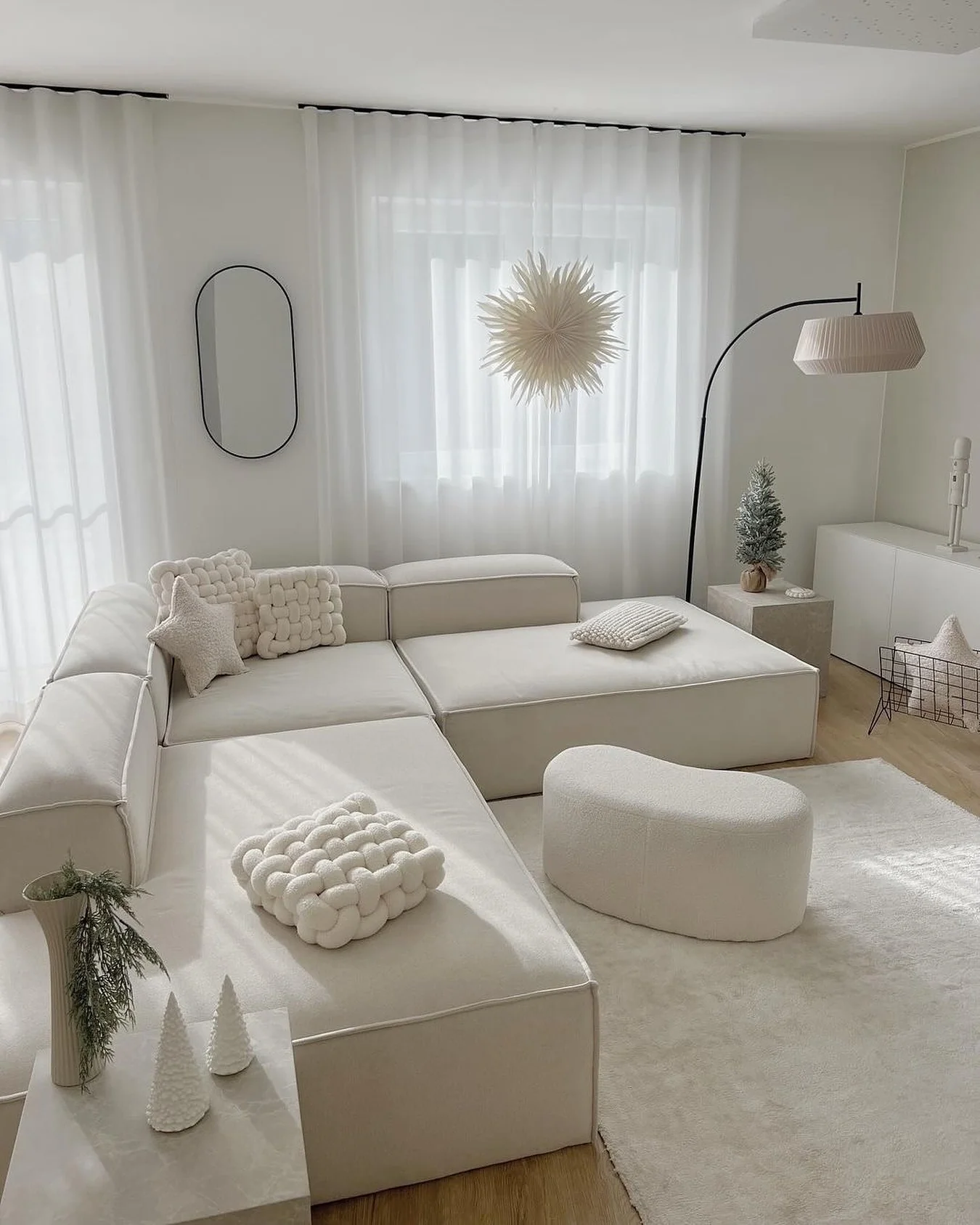 25. Soft White Geometry With Sculptural Accents (Cozy Living Room Ideas)