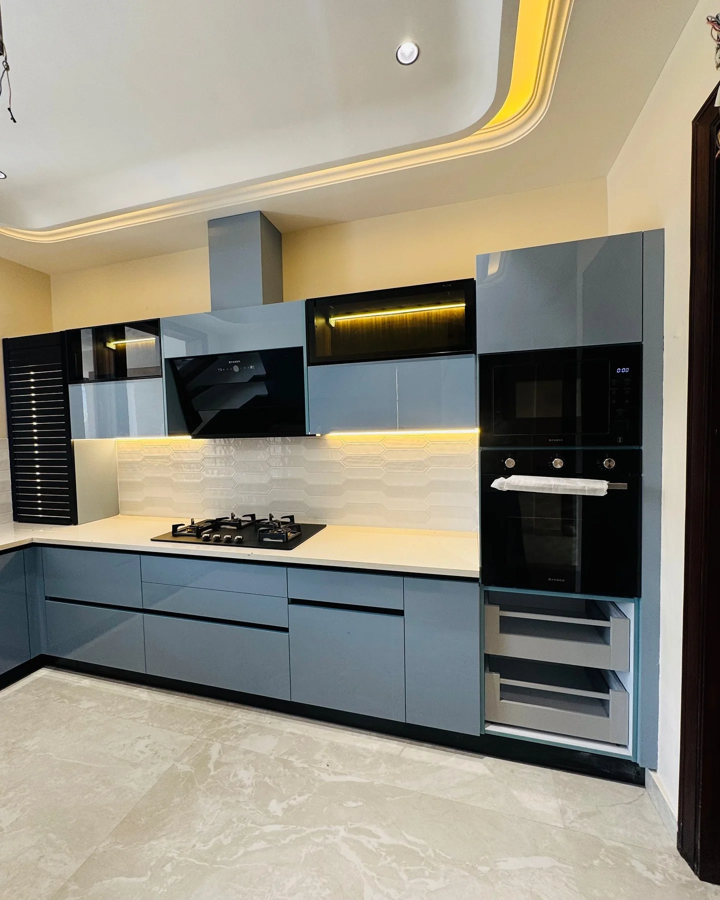 3. Gloss Graphite Cabinets with Futuristic Edge (Dark Cabinets Kitchen Ideas)