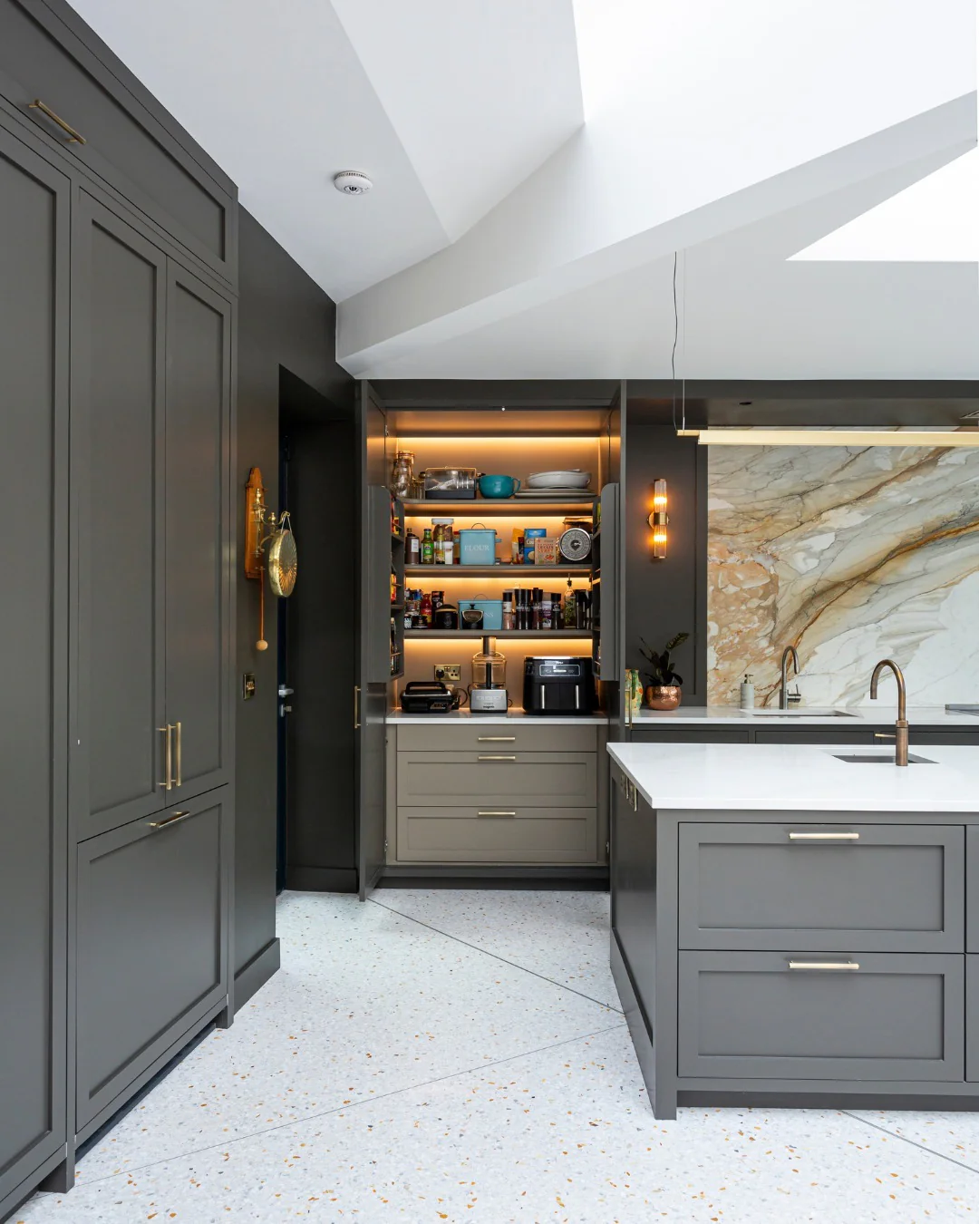 7. Charcoal Pantry Niche with Light-Reflective Terrazzo (Dark Cabinets Kitchen Ideas)