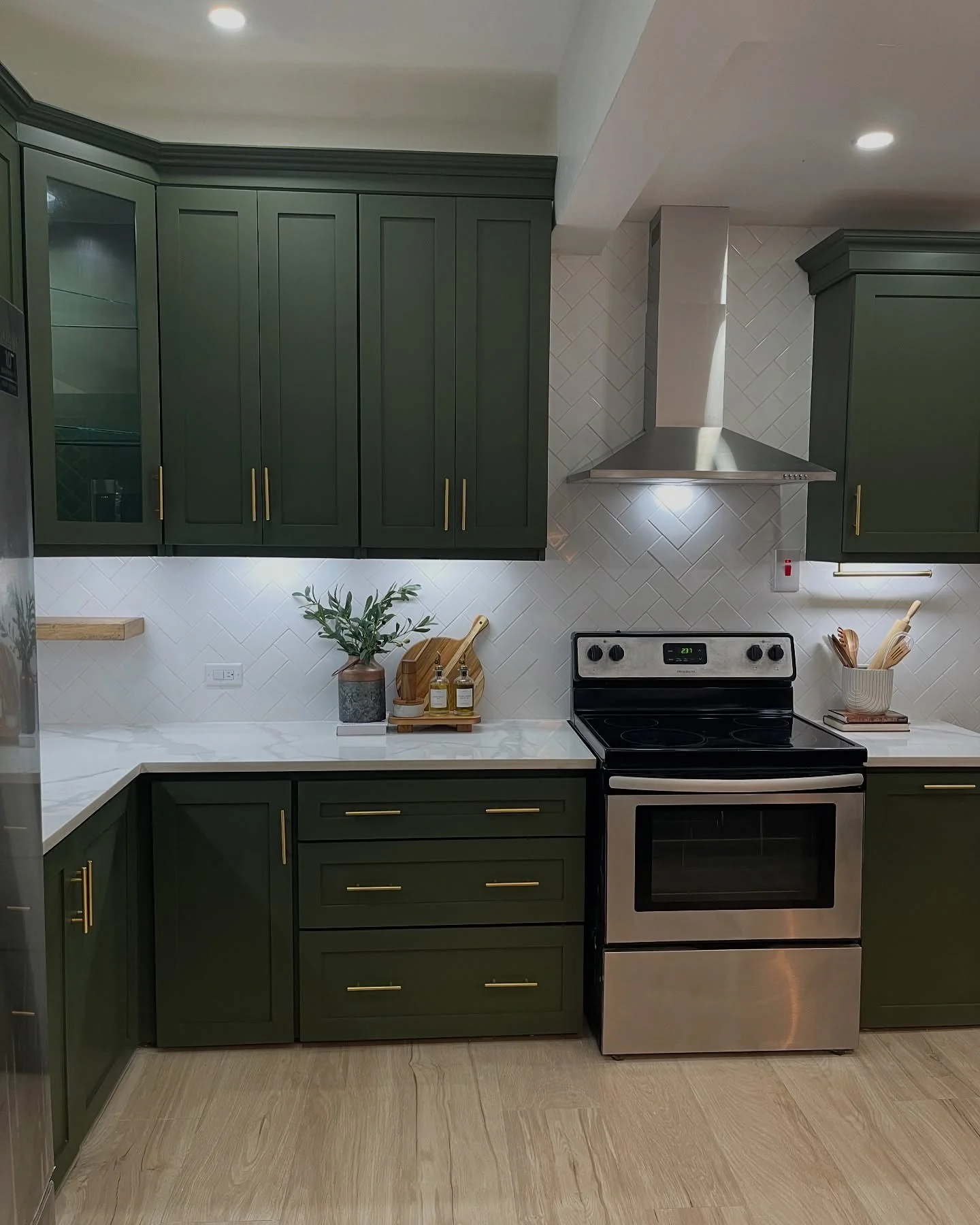 18. Olive Green Cabinets with Brass Pulls and Chevron Tile (Dark Cabinets Kitchen Ideas)