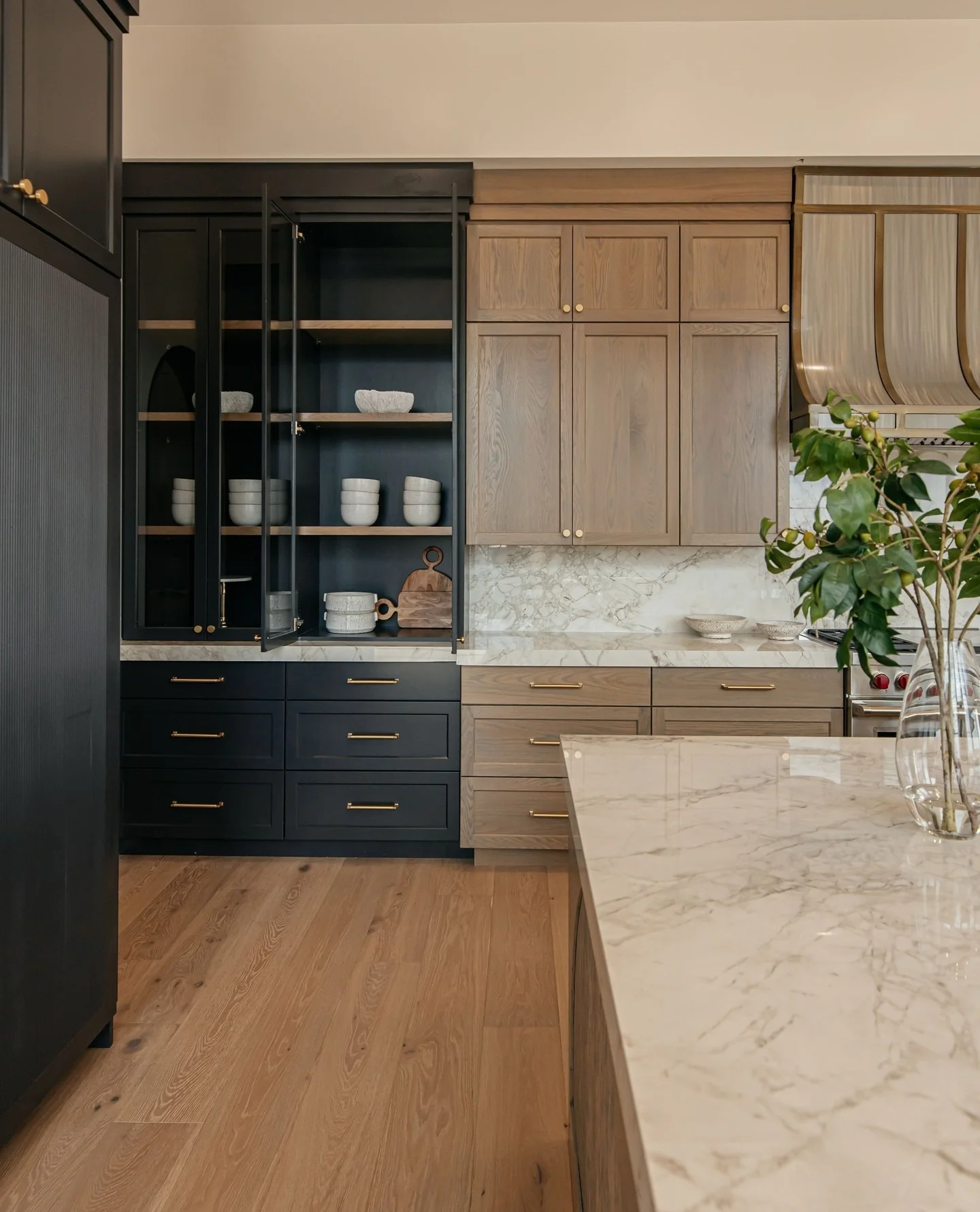 20. Ebony and Oak Two-Tone Kitchen with Marble Counters (Dark Cabinets Kitchen Ideas)