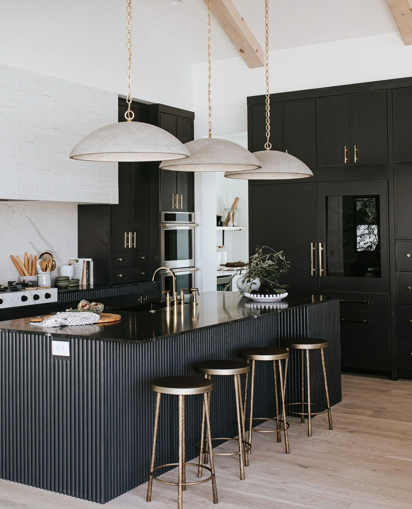 2. Contemporary Luxe with Brass and Texture (Black Cabinets Kitchen Ideas)