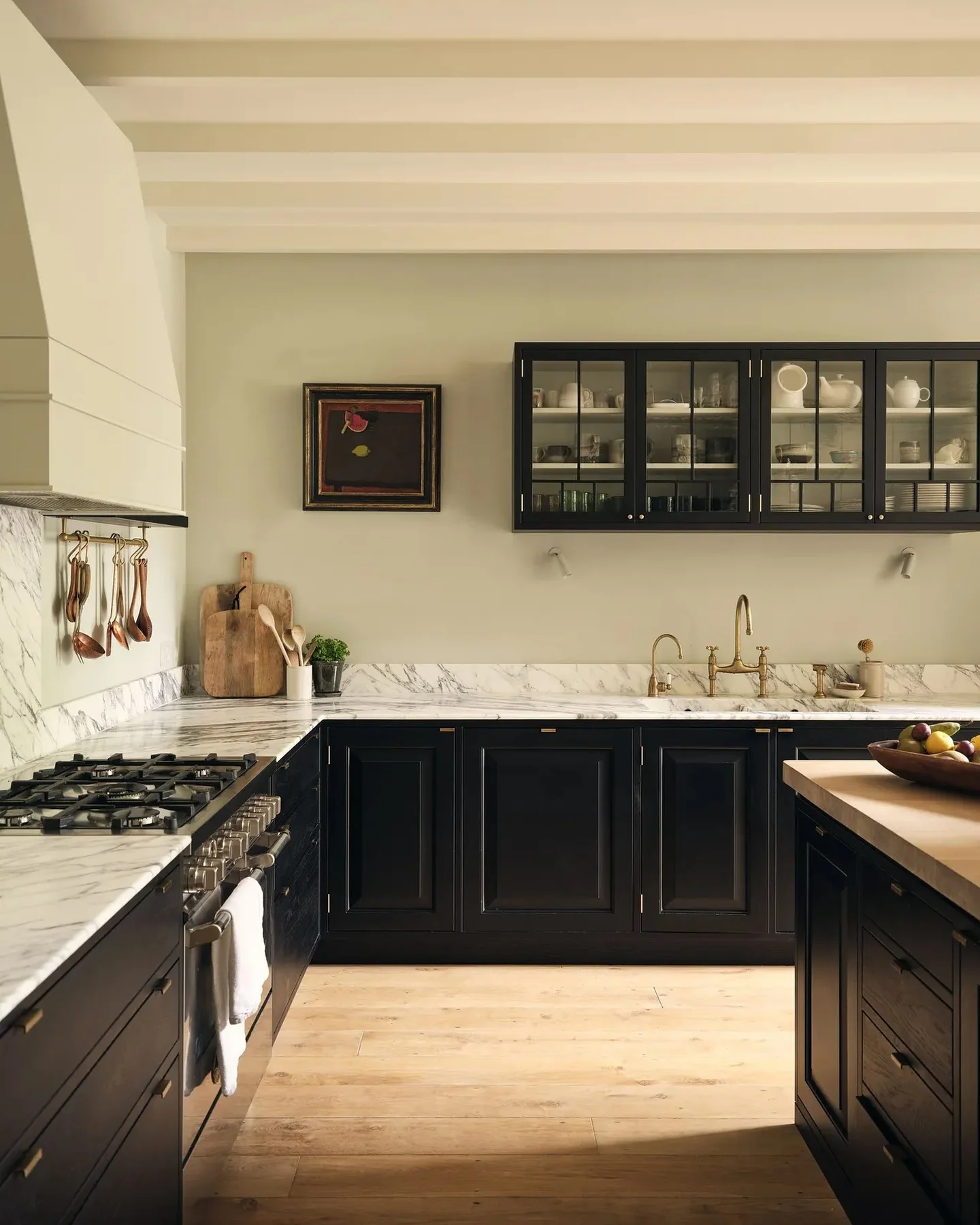 16. Elevated Classic with Display Storage (Black Cabinets Kitchen Ideas)