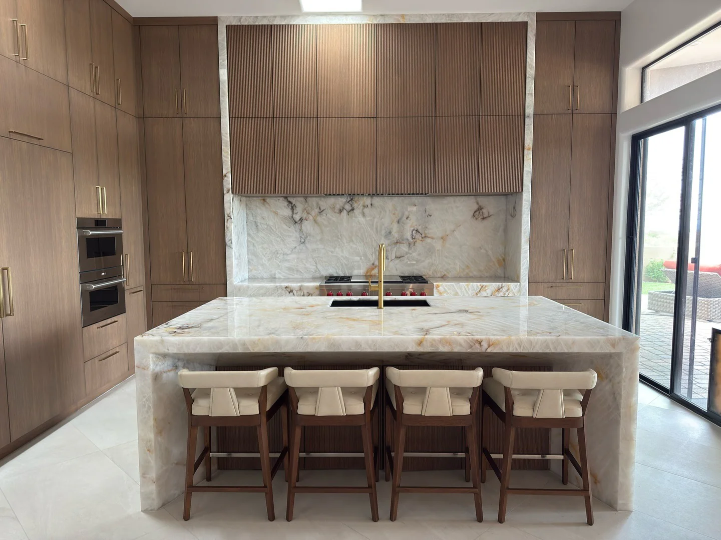 8. Refined Monochrome with Marble Luxury (Brown Kitchen Cabinets Ideas)