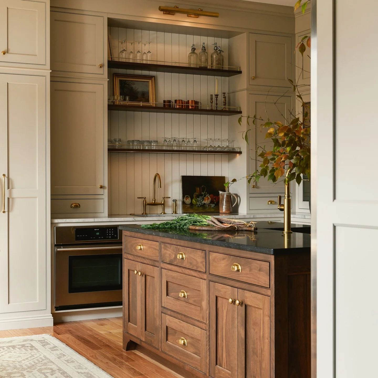 11. Warm Walnut Island with Classic Cream Cabinetry (Brown Kitchen Cabinets Ideas)