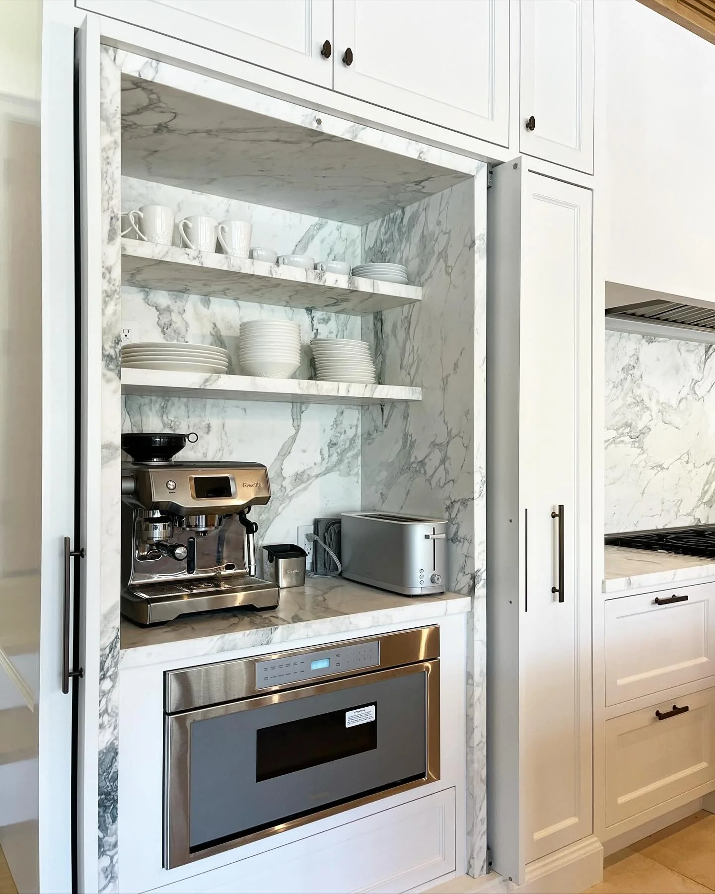 5. Integrated Appliance Niche with Sleek Marble (Garage Kitchen Ideas)