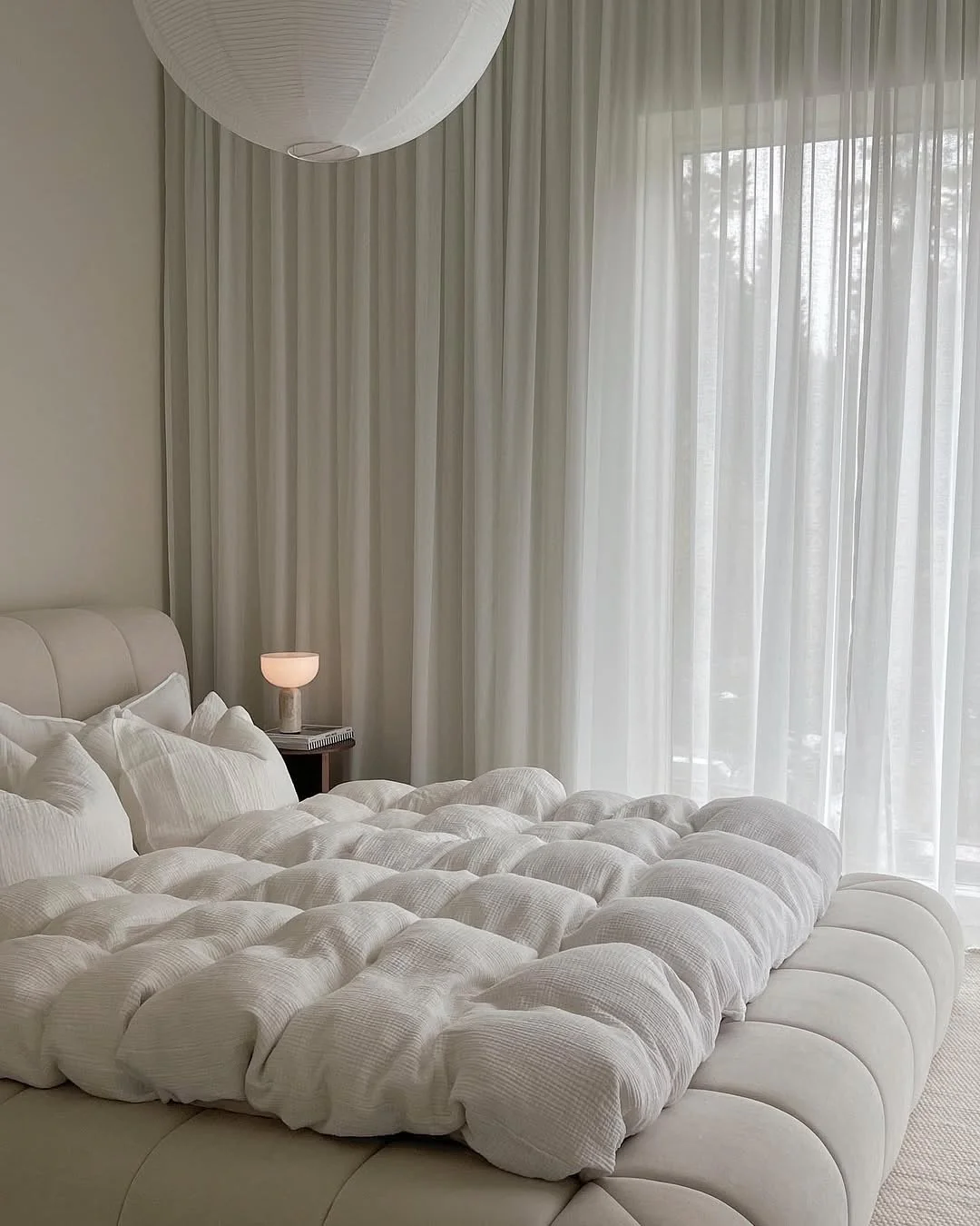 6. Cozy Cloud-Like Layers in a Softly Draped Retreat (Sunroom Bedroom Ideas)