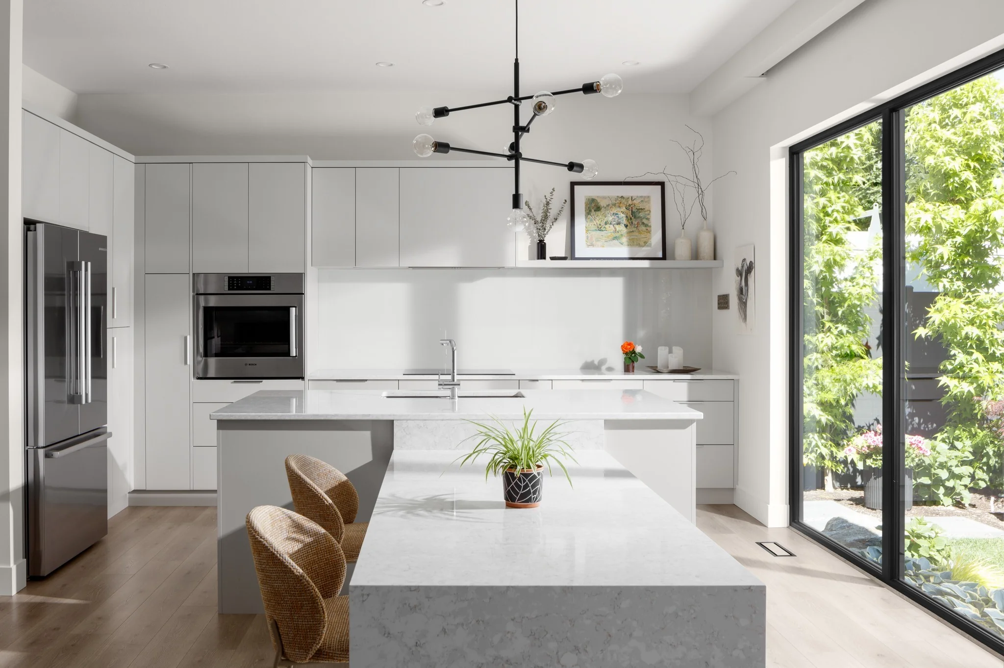 20. Light-Filled Kitchen with Waterfall Island and Midcentury Flair (Modern Kitchen Ideas)