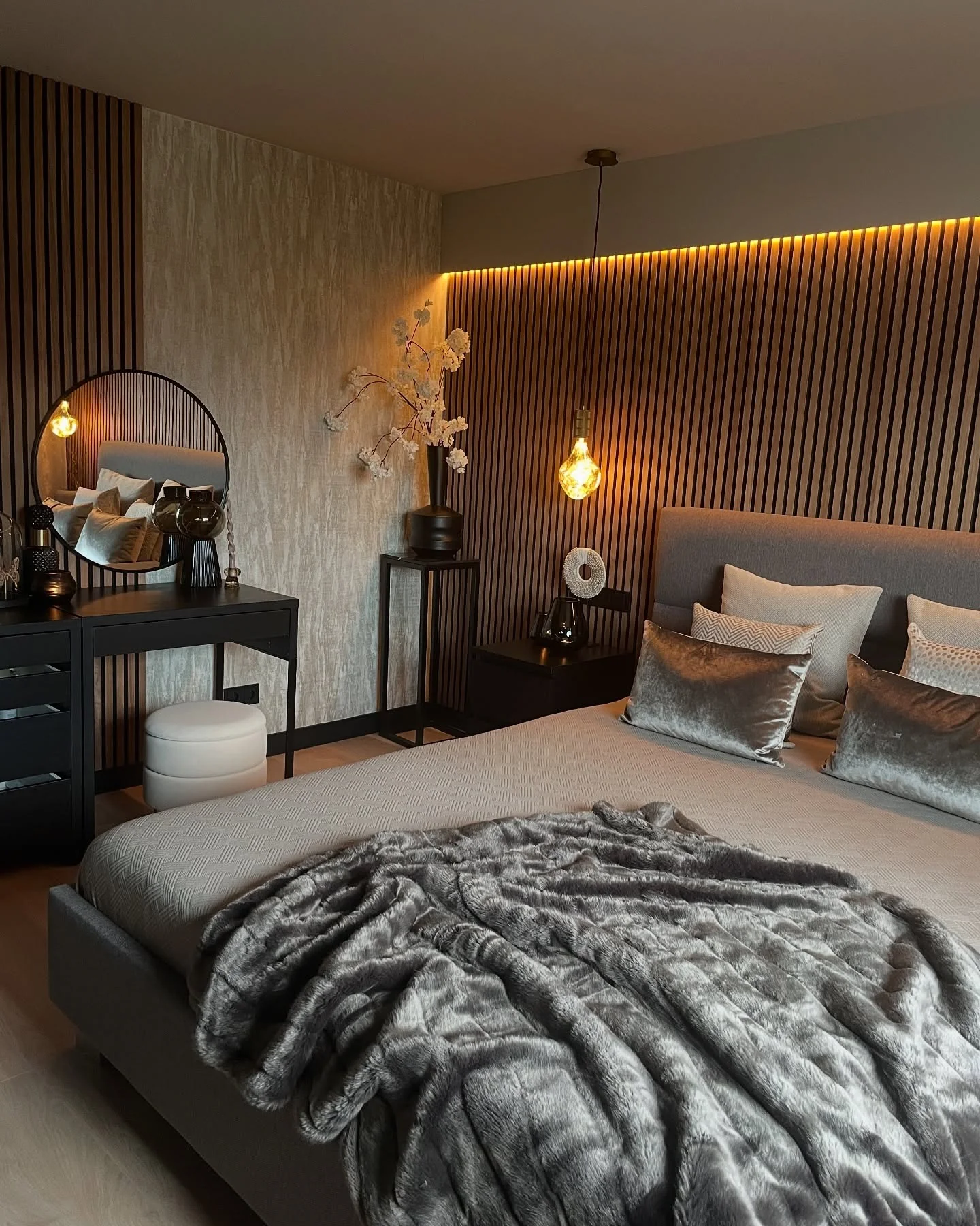 4. Warm Wood and Amber Glow (Moody Bedroom Ideas)