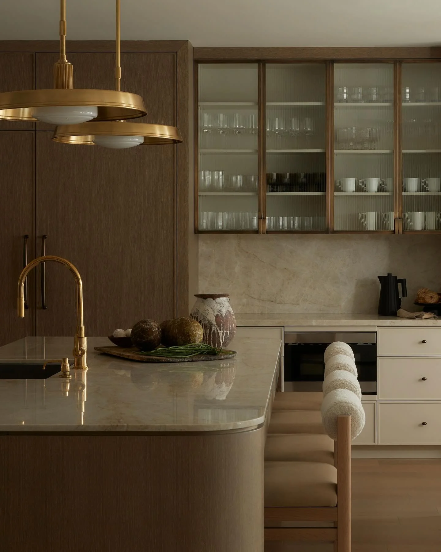 8. Muted Luxe with Rounded Silhouettes (Brown Kitchen Ideas)