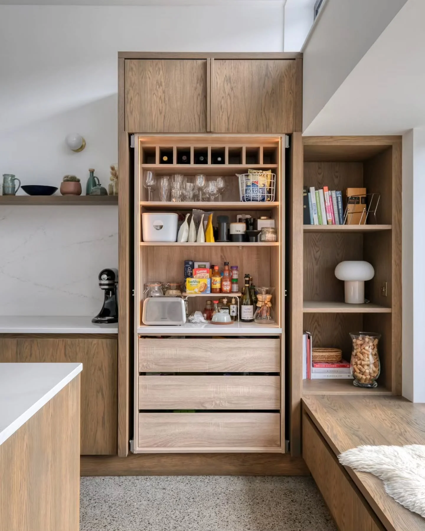 12. Hidden Pantry Chic in Soft Oak (Brown Kitchen Ideas)