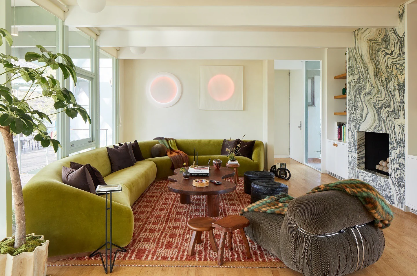 9. Groovy Retro Earth Tones with Bold Form (Earth Tones Living Room Ideas)