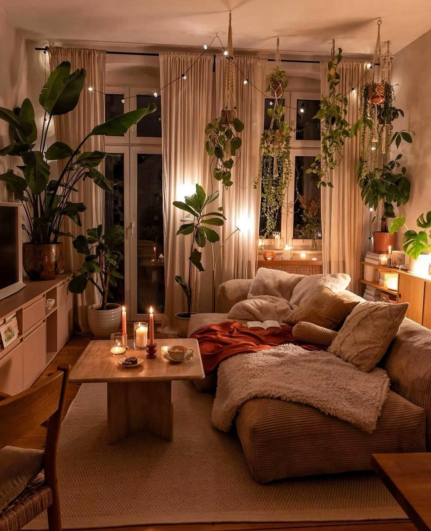 12. Candlelit Jungle with Earthy Comfort (Earth Tones Living Room Ideas)