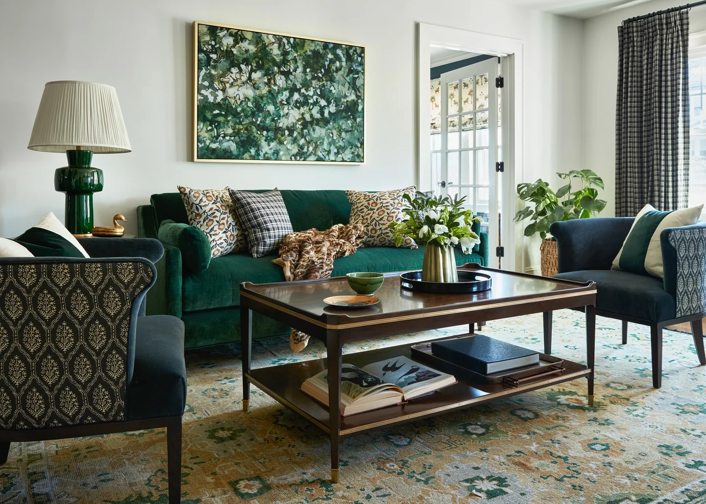 3. Classic Collected: Emerald Sofa with Brass, Cream, and Pattern (Emerald Green and Gold Living Room Ideas)